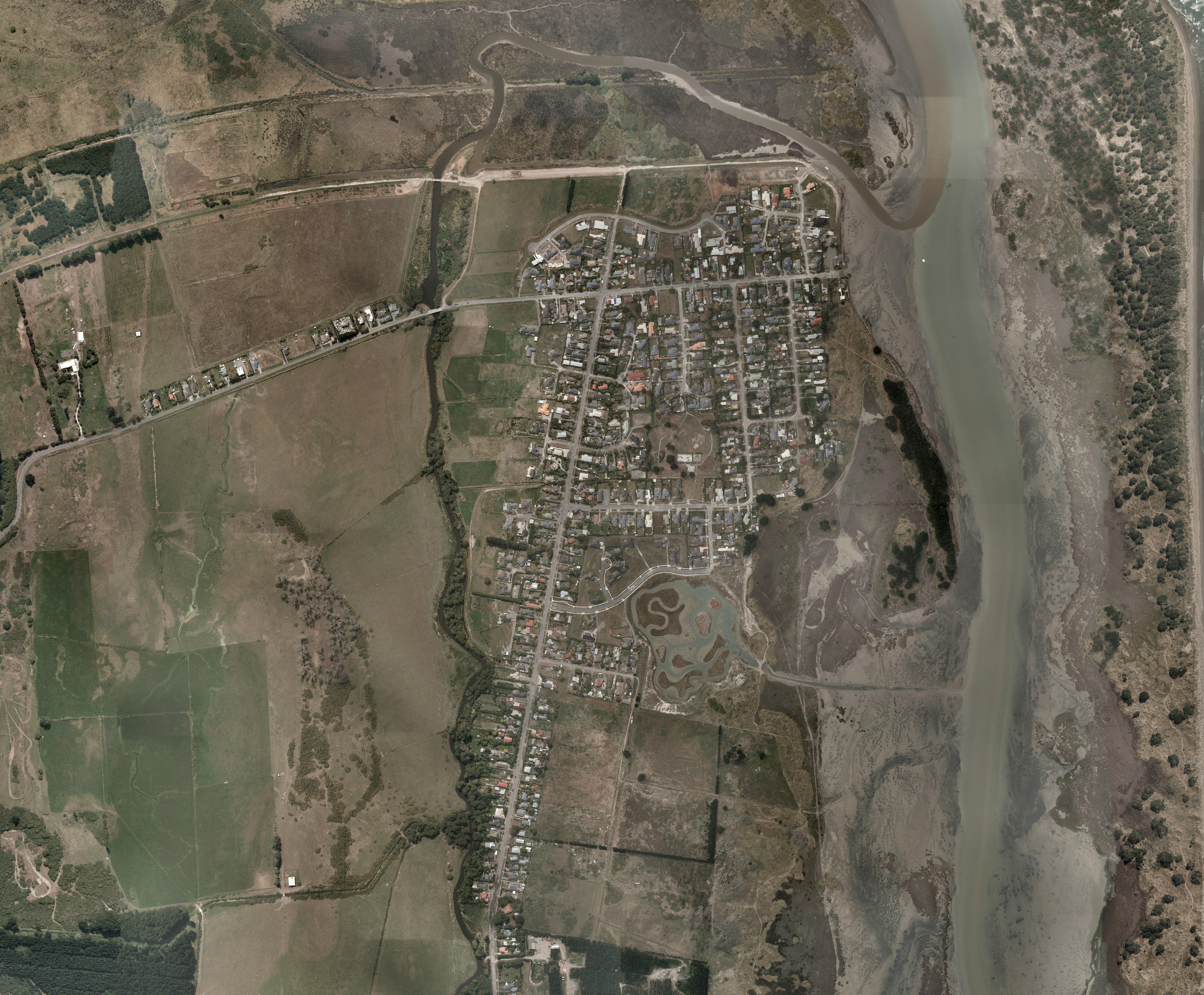 A sprawling Brooklands captured from the air just after the February 22, 2011 earthquake. Photo / Toitu Te Whenua Land Information New Zealand