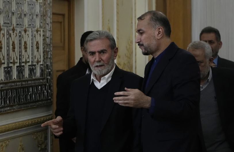 The leader of the Palestinian Islamic Jihad group Ziad Nakhaleh, left, and the Iranian Foreign Minister Hossein Amirabdollahian, arrive for signing a guest book by Nakhaleh, after their meeting in Tehran, Iran on March 30. (AP Photo/Vahid Salemi)