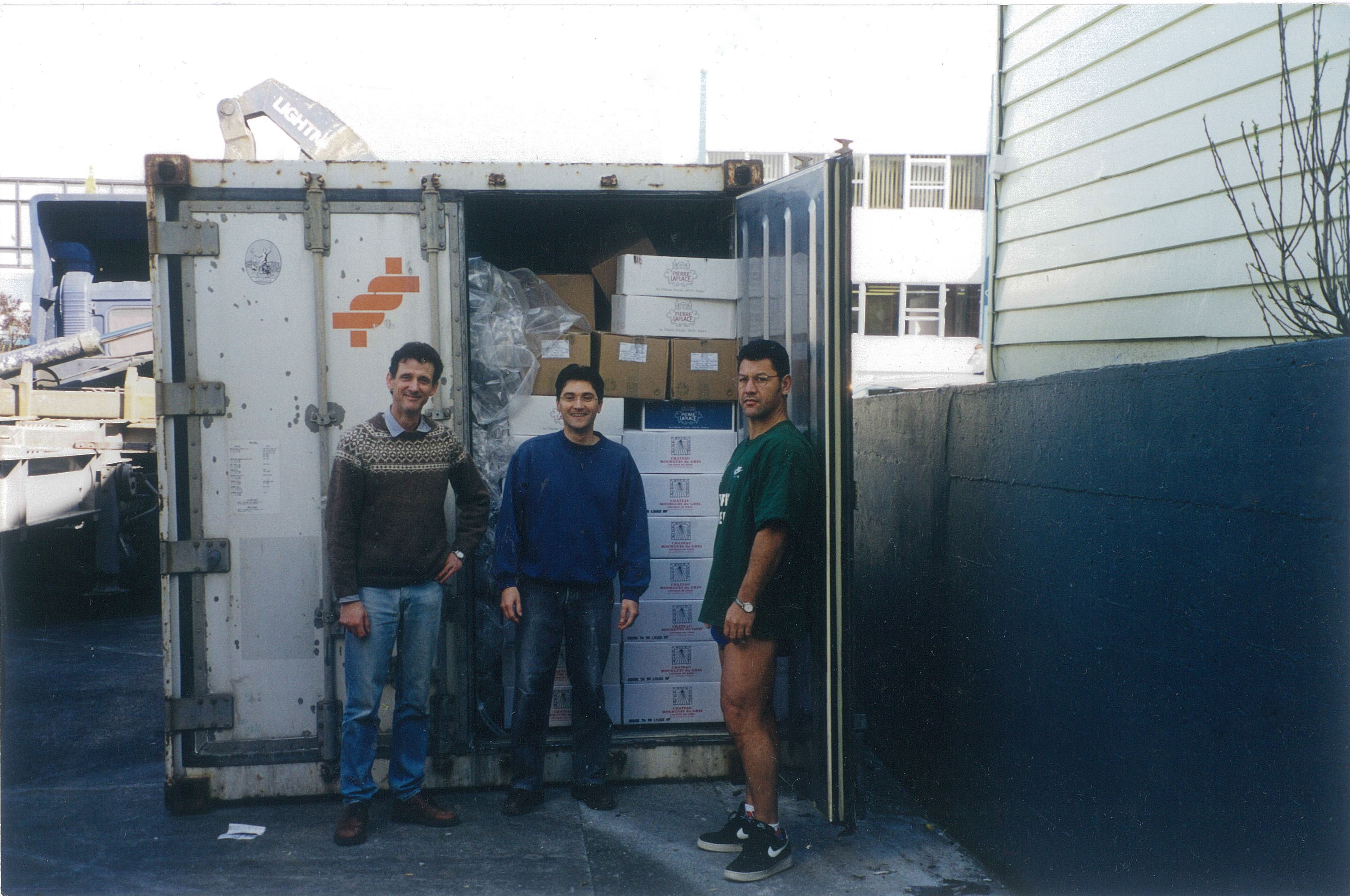 Scott Gray, Jean-Christophe Poizat and Peter Ropati unloading their first ever container of wine. Photo / Supplied