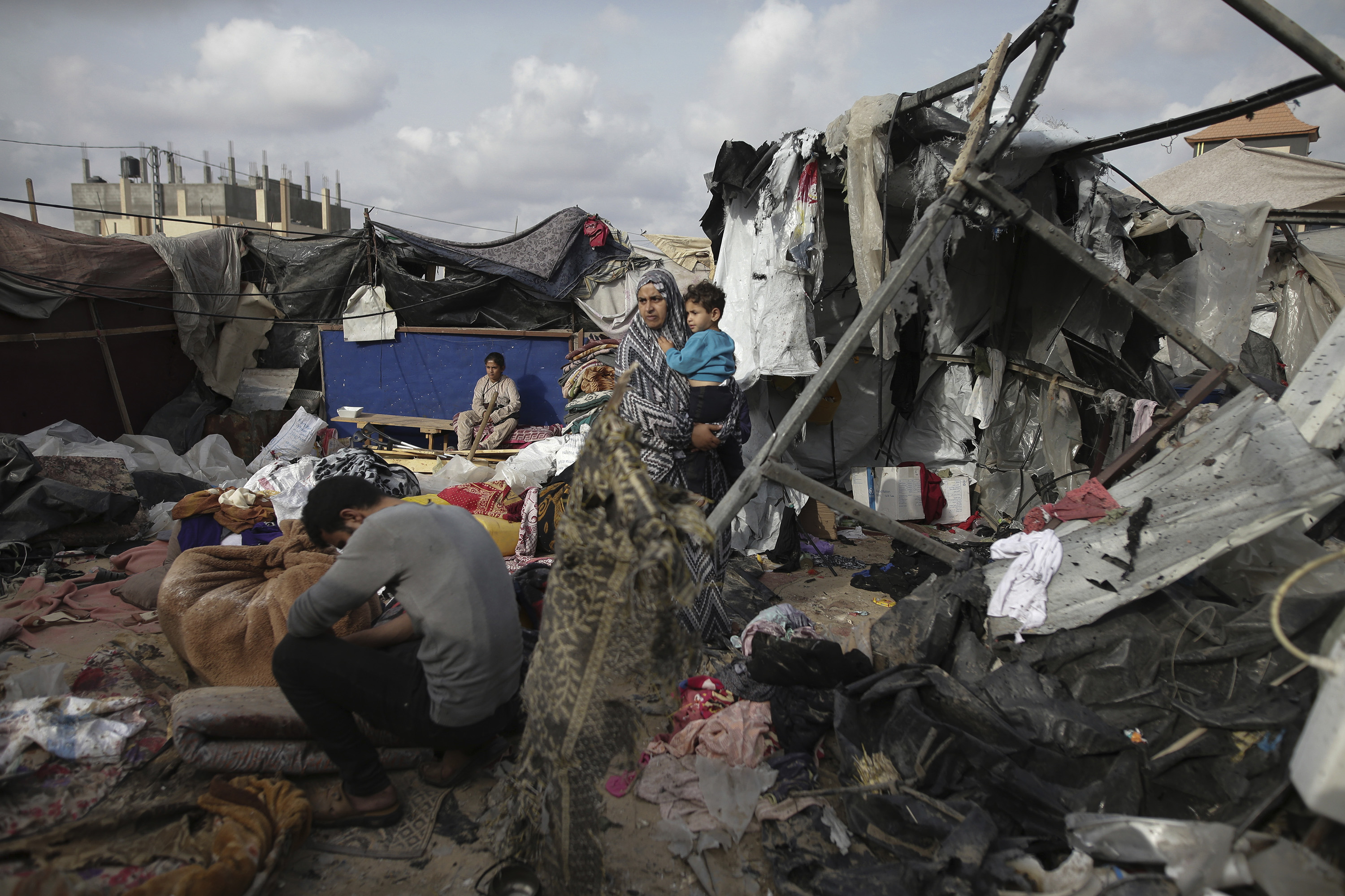 Displaced Palestinians inspect their tents destroyed by Israel's bombardment. Photo / AP
