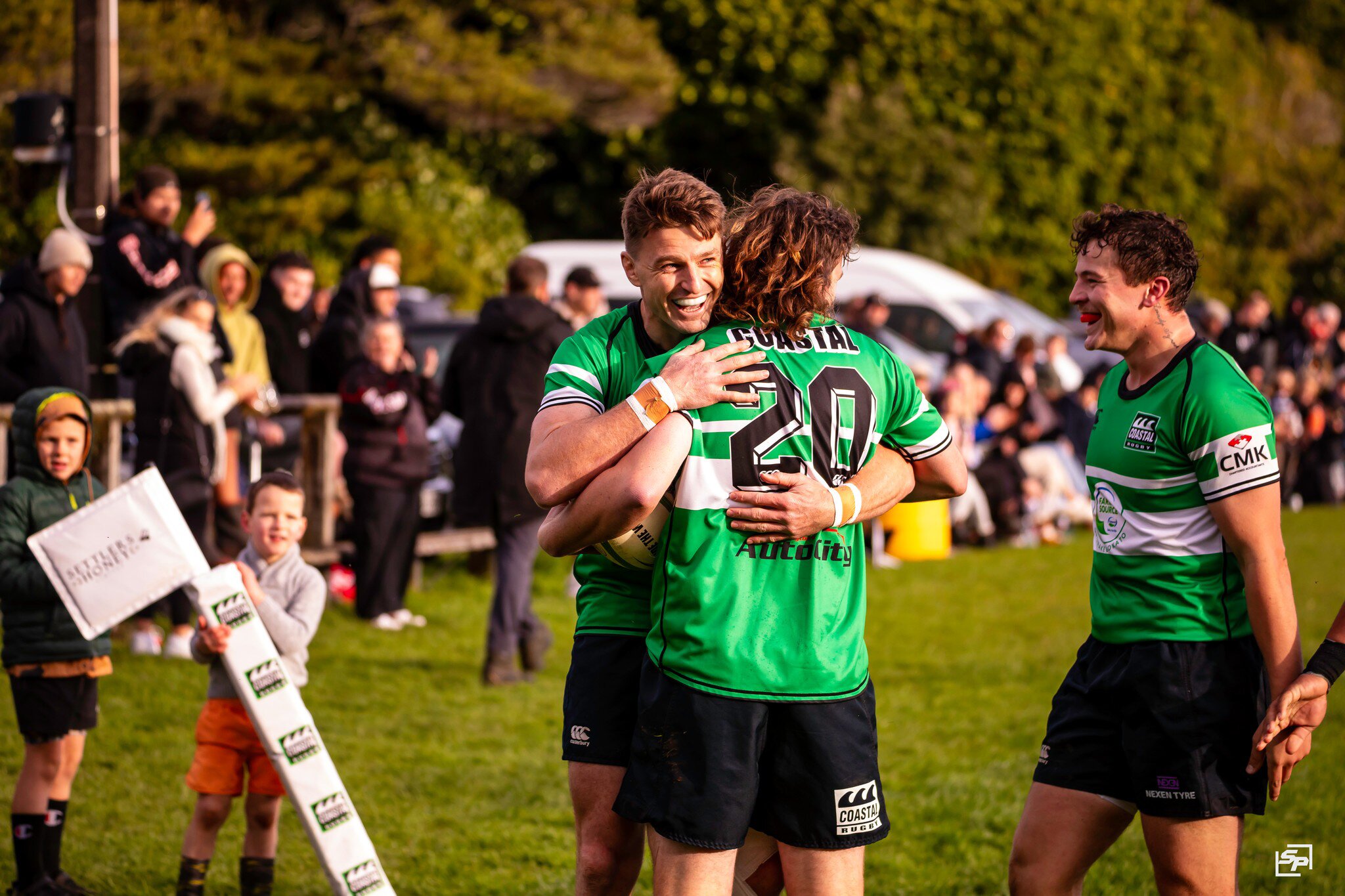Beauden Barrett celebrates with Coastal teammates. Photo / Spinna Photography