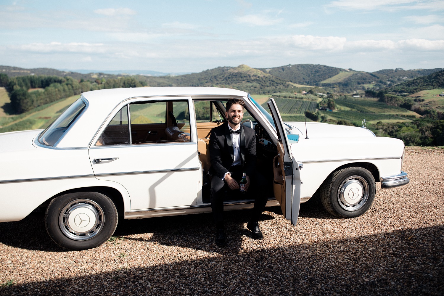 A vintage Mercedes whisked the couple away after the ceremony. Photo / Andrew Hewson