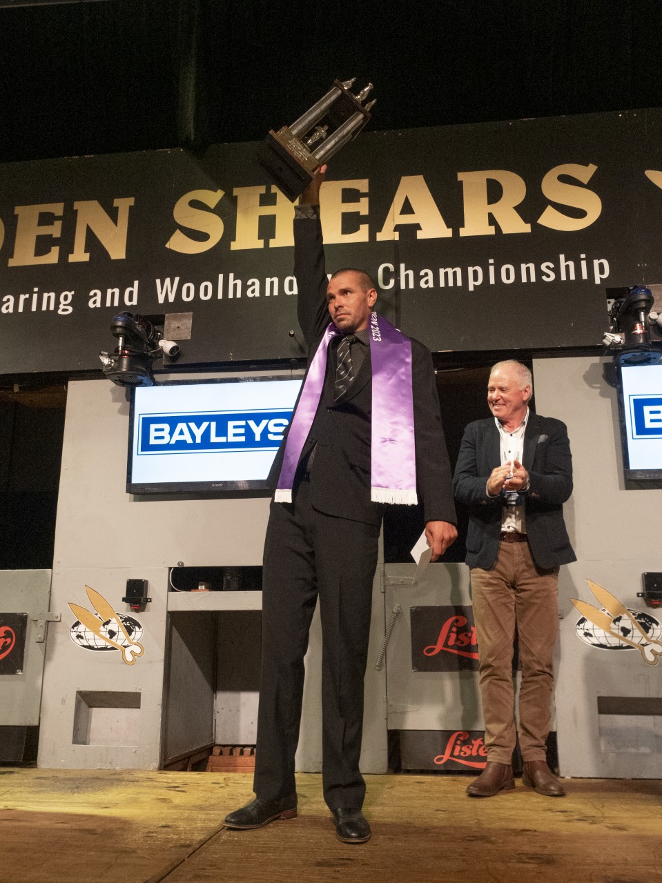Rowland Smith, of Maraekakaho, Hawke's Bay, salutes his late father after winning the Golden Shears open shearing title for an eighth time. Photo / Pete Nikolaison / Golden Shears Media Group