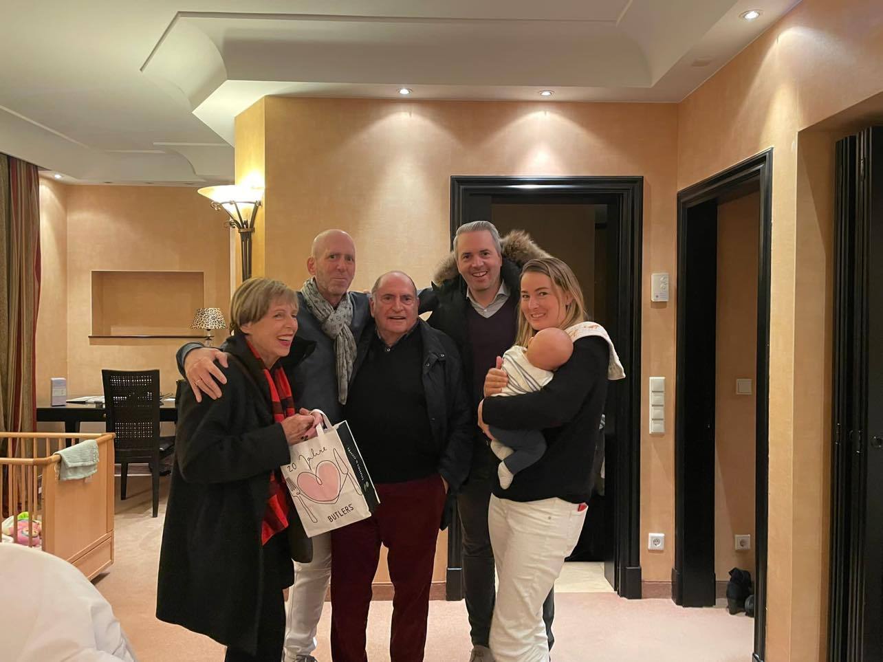 Finn Batato's arrival in Munich, Germany, with mother Frauke and father Jean Batato along with brother Leif Batato and Finn's partner Simone, holding their son Luca. Photo / Supplied
