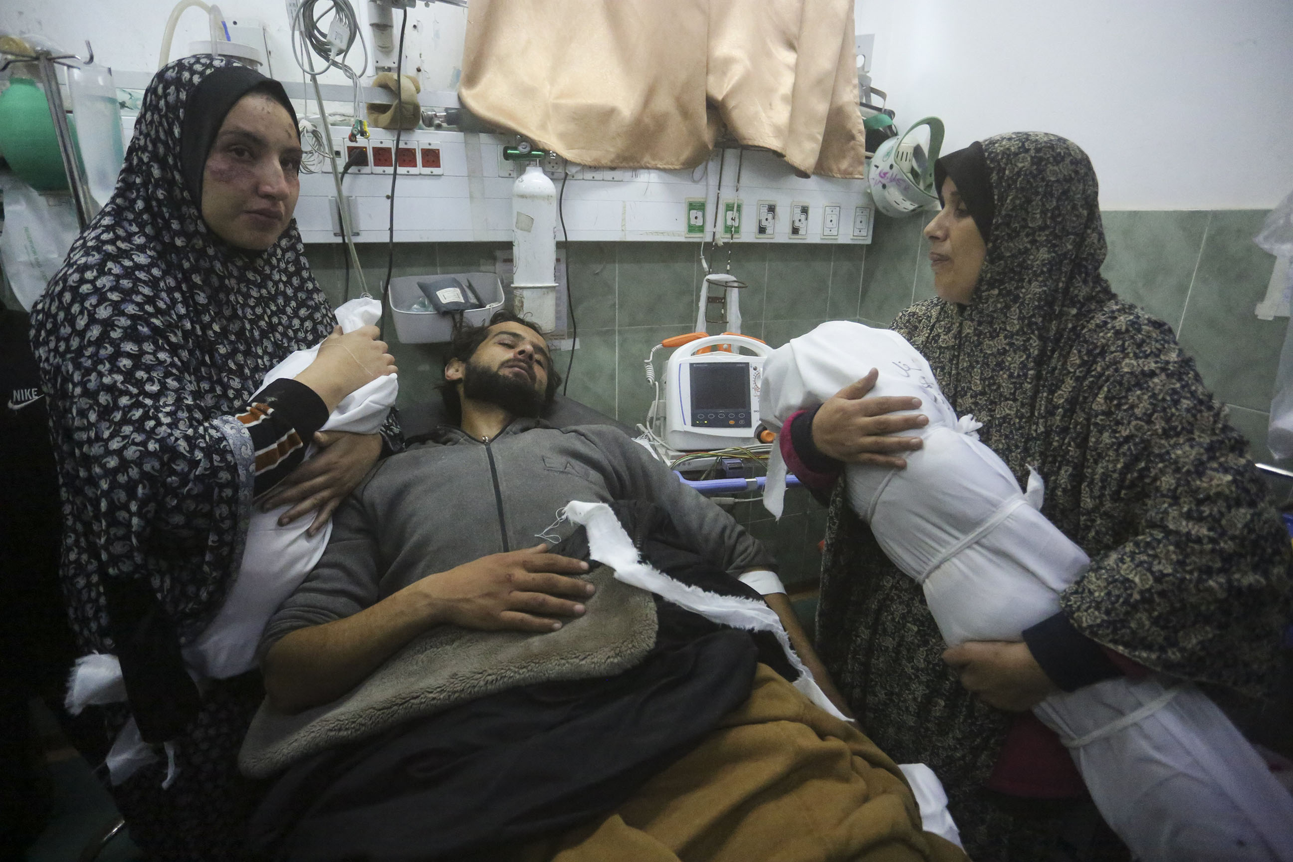 The Zoarab family grieve the loss of their newborn girl Amira and her 2-year-old brother Ahmed after their home collapsed on them in an Israeli airstrike. Their father was also injured in the blast and is here in hospital. Photo / AP