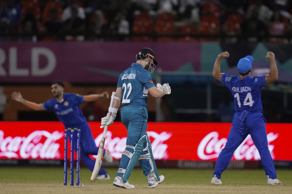 Kane Williamson leaves the field after being caught by Gulbadin Naib off the bowling of Rashid Khan. Photo / AP