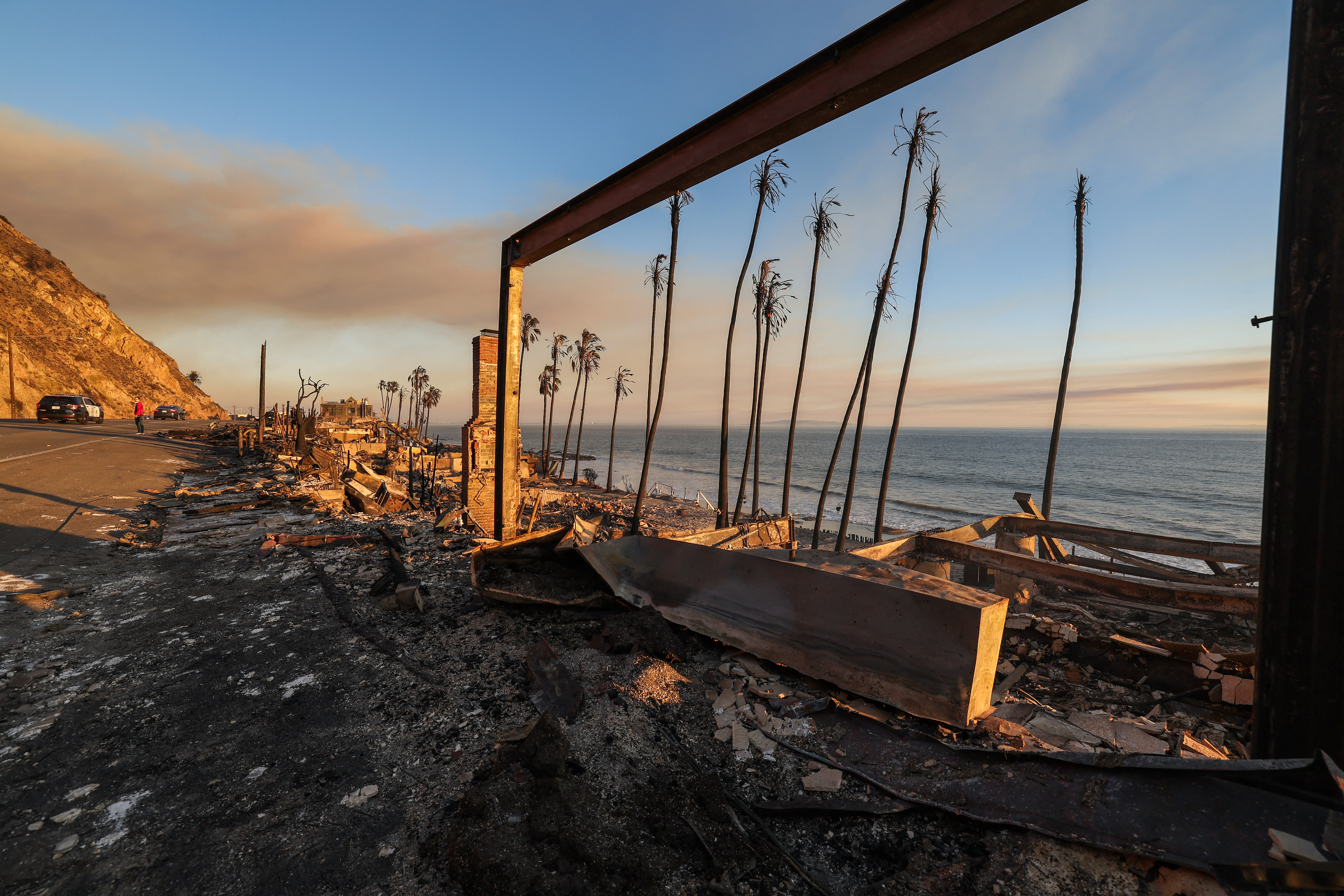 Burned-out beachfront homes destroyed by the Palisades fire are seen along Pacific Coast Highway in Malibu. Photo / AFP