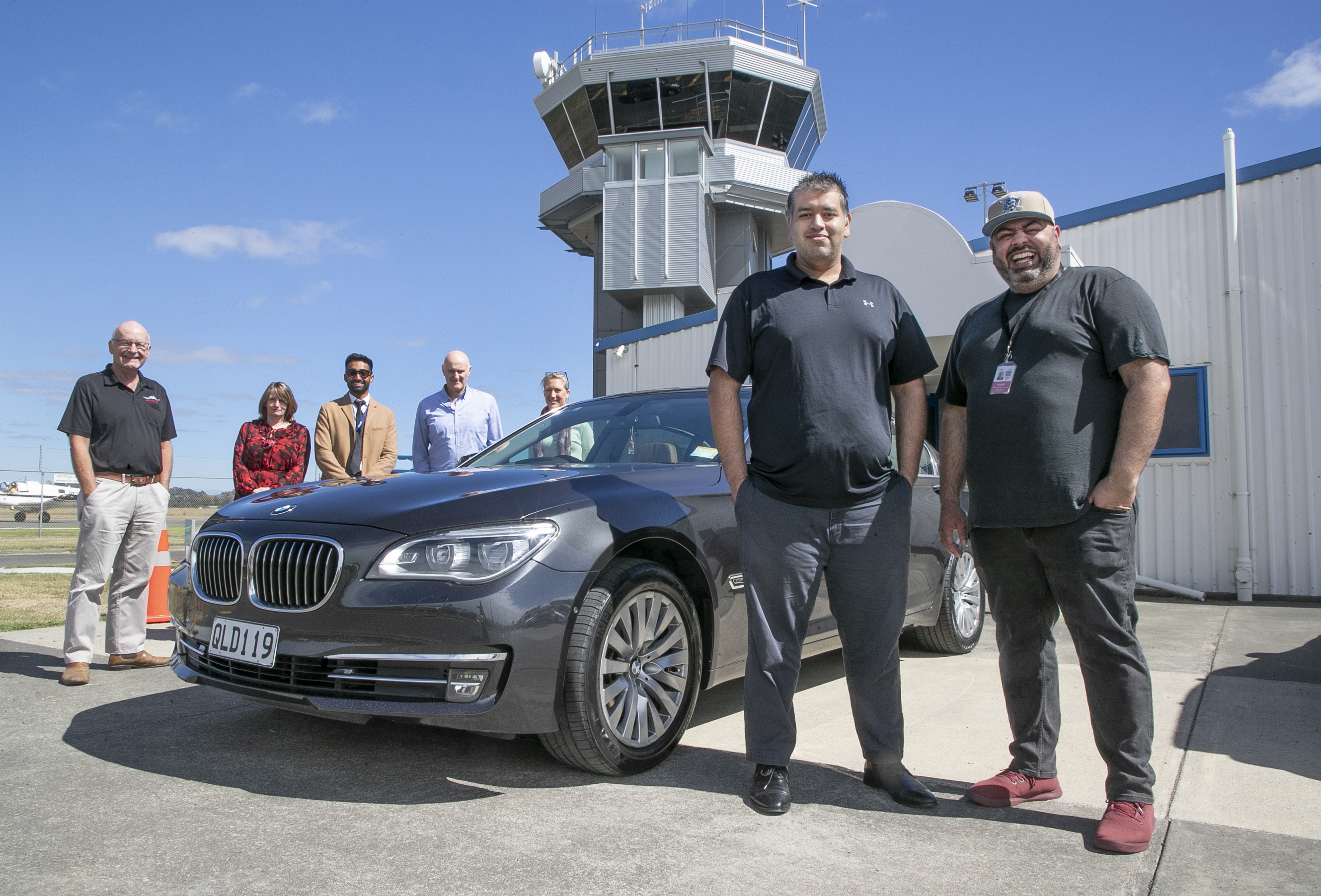 Air Napier chief operating officer Arsel Aslam (right) stands next to chief executive Shah Aslam and the Air Napier staff outside the company's terminal at Hawke's Bay Airport. Photo / Warren Buckland