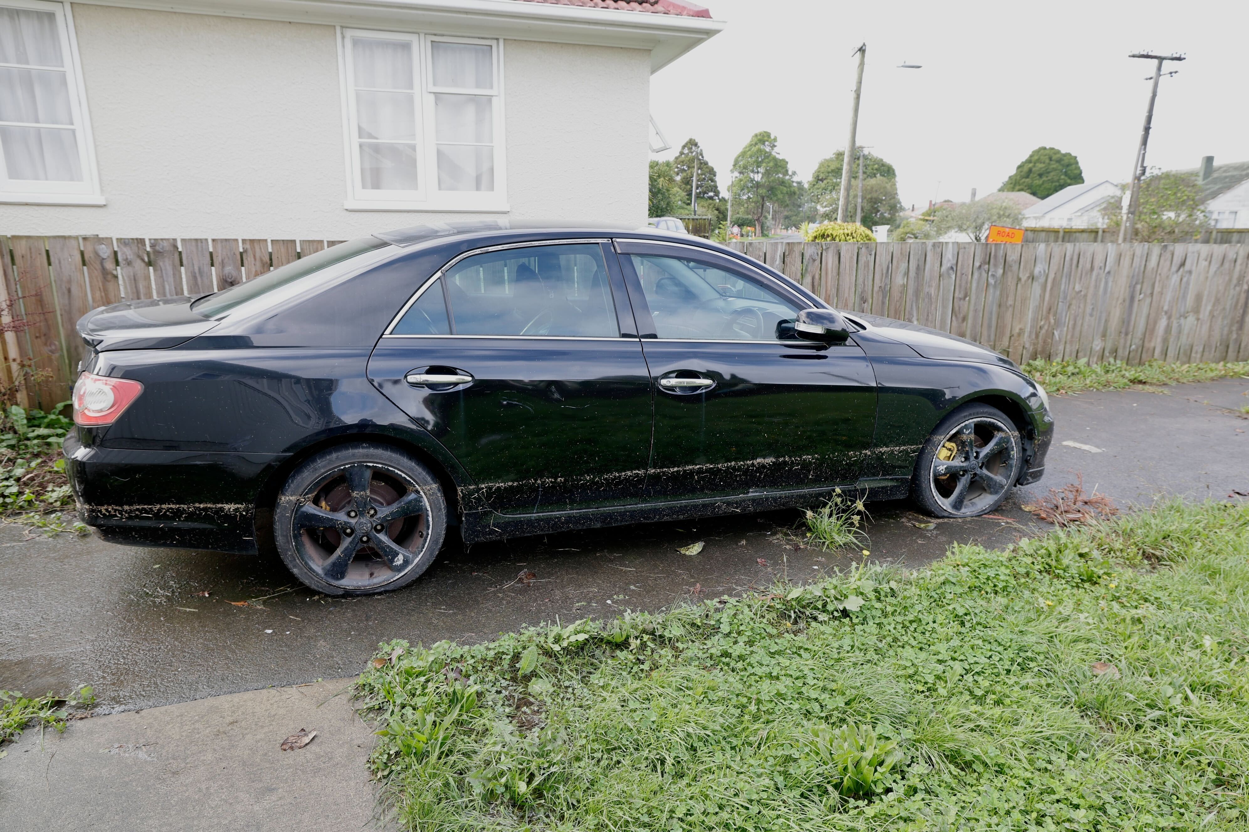 The marks on Chrissy's daughter's car show how high the floodwaters reached overnight. Photo / Dean Purcell