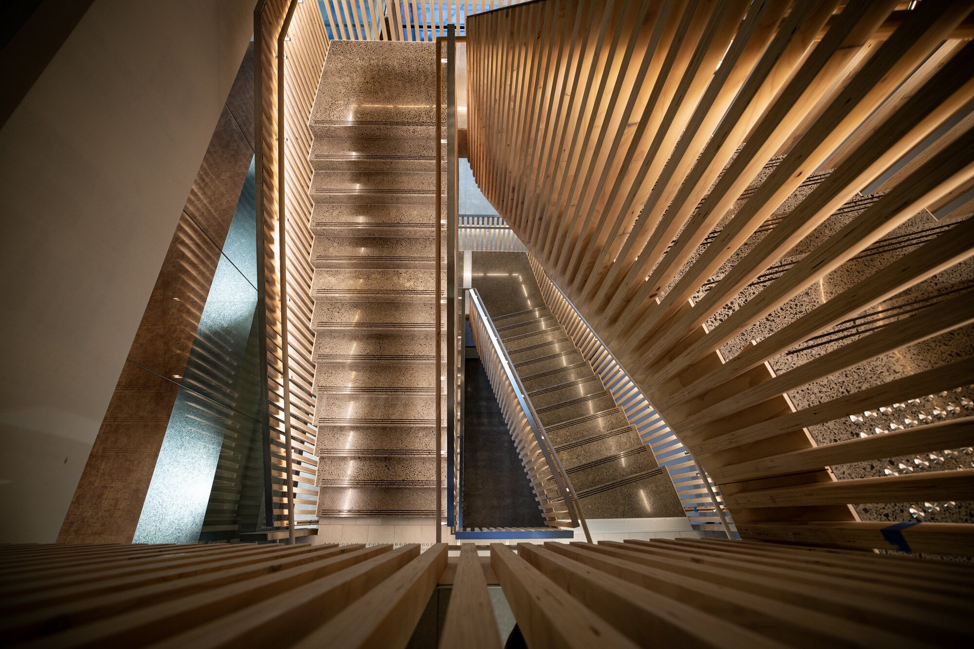 The statement mass timber staircase in Beca's new offices. Photo / Dean Purcell