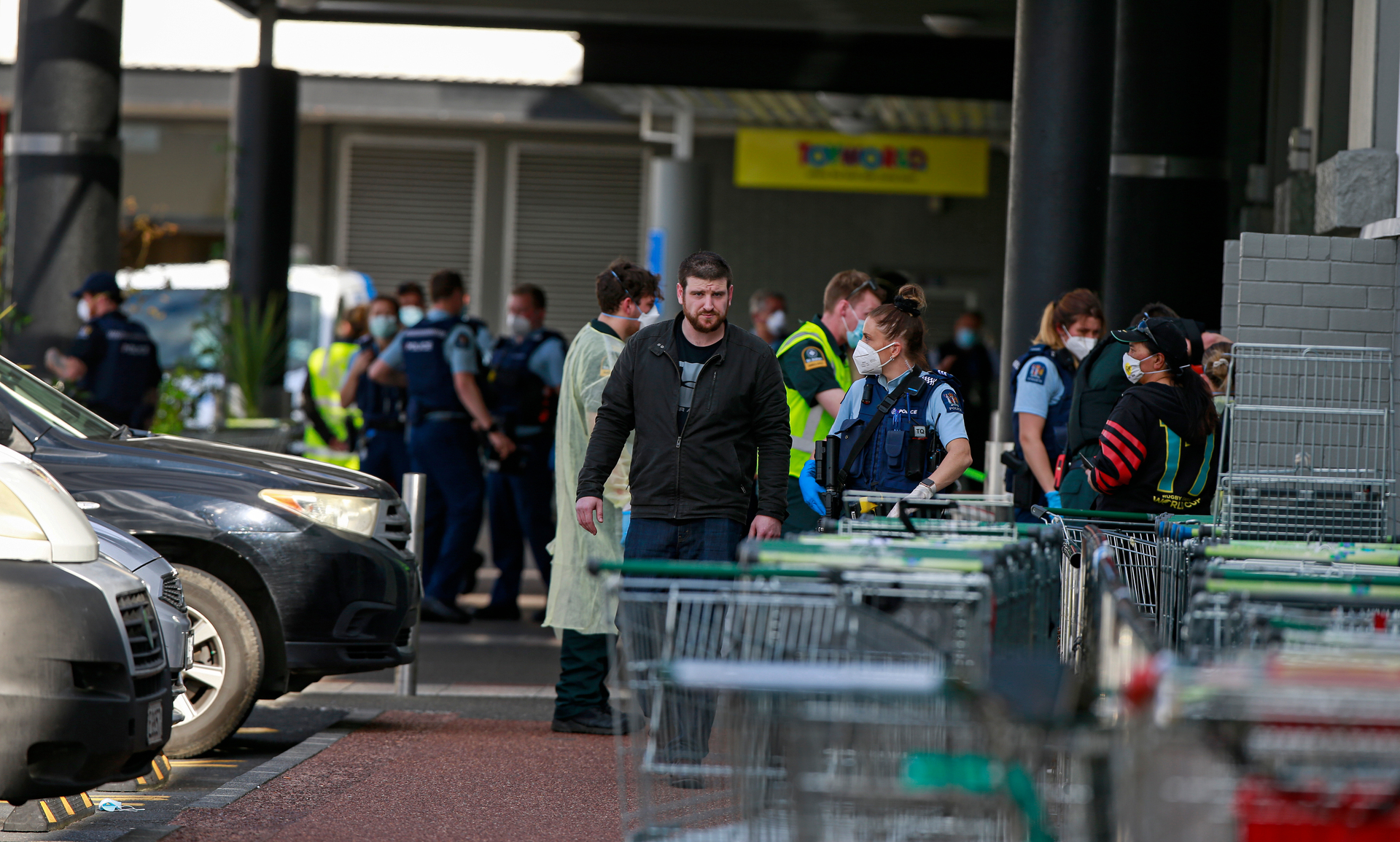 Ross Tomlinson outside Lynn Mall being spoken to by a police officer on the day of the stabbing terror attack. Photo / Alex Burton
