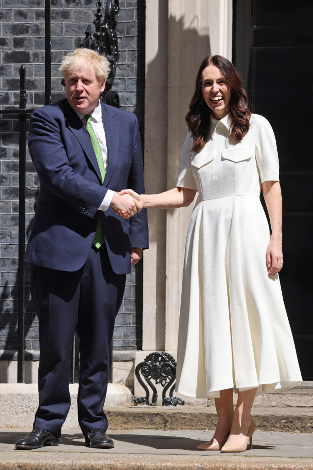 Ardern meets with former British Prime Minister Boris Johnson in London in 2022, wearing Emilia Wickstead.