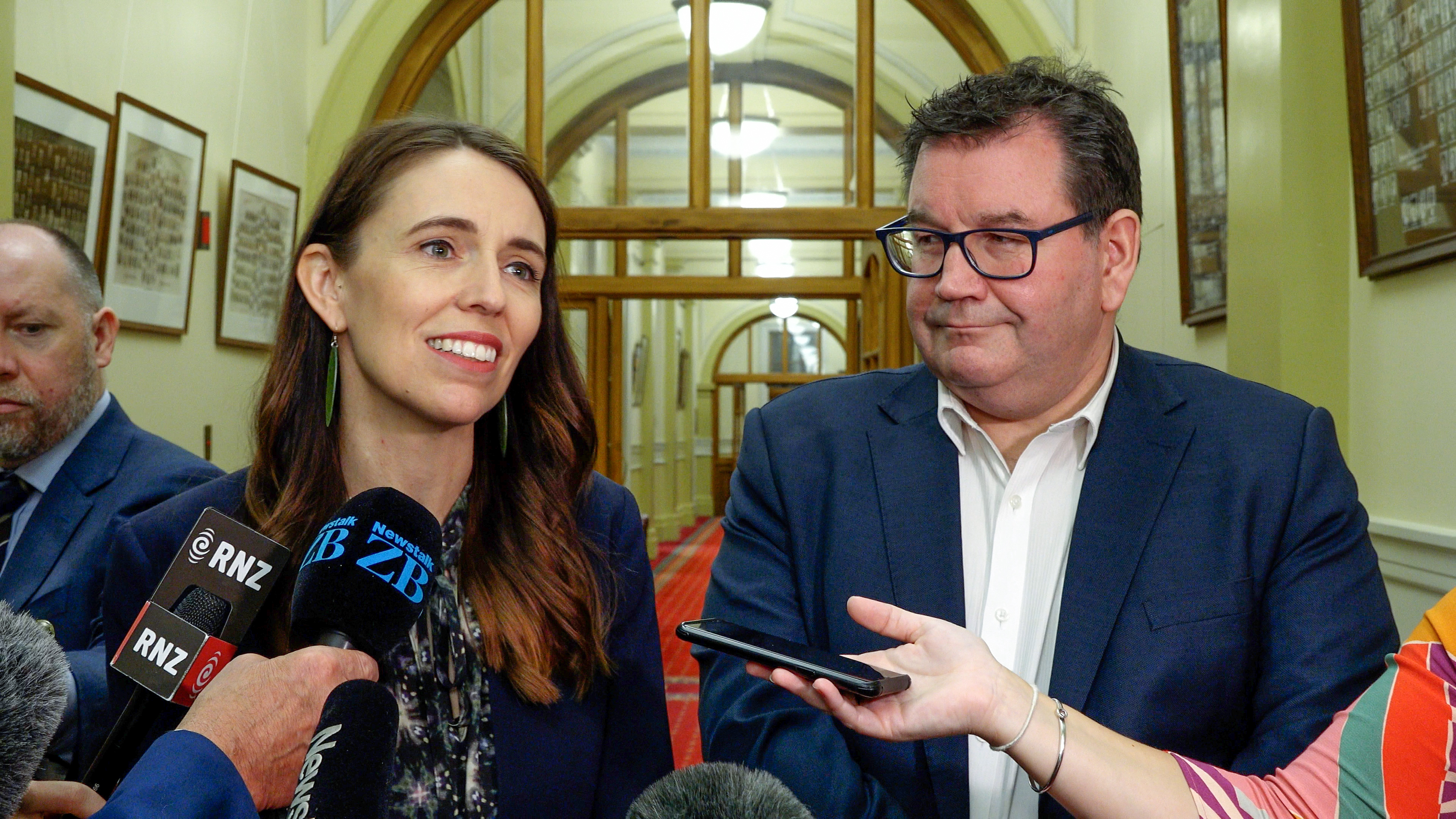 Jacinda Ardern and Finance Minister Grant Robertson with Ardern's chief press secretary Andrew Campbell (l). Photo / Mark Mitchell