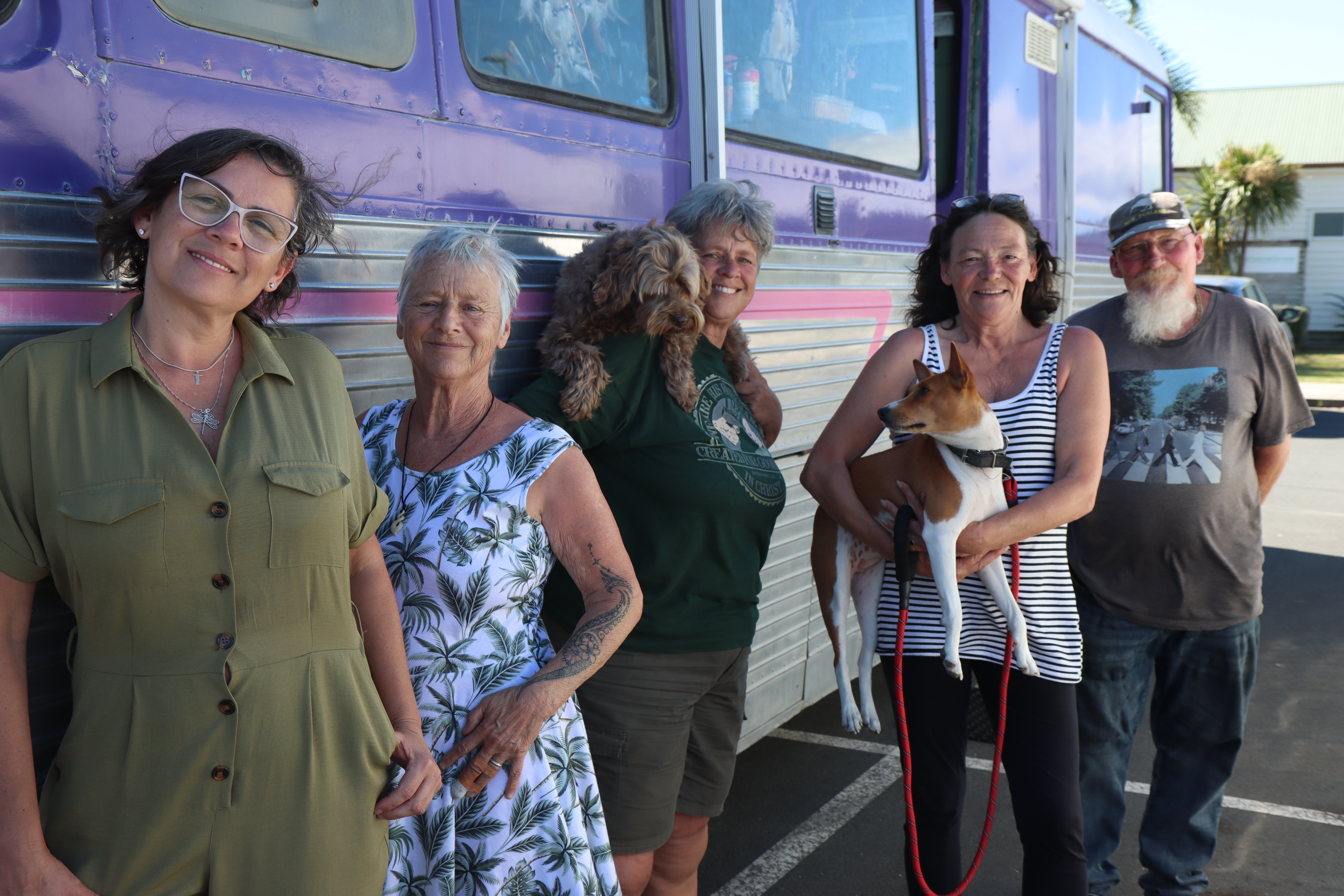 Josie (from left), Rosie, Chris Garland with dog Rio, Tracey and pet Mia, and Steve have lived in Cobham Oval carpark. Photo / Karina Cooper