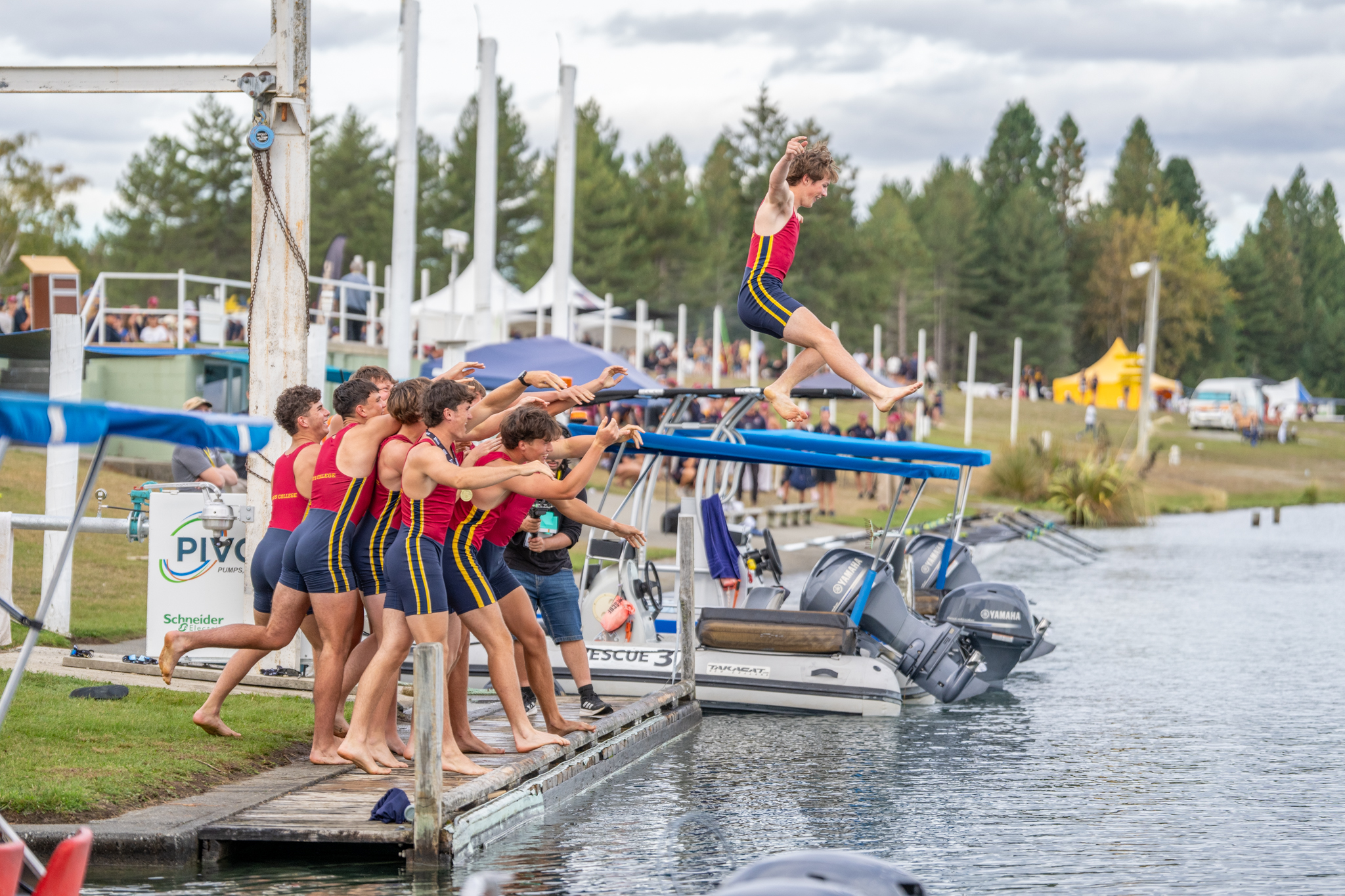 King's College cox Ayden Miller is tossed into Lake Ruataniwha as his crew celebrate winning the 2026 Maadi Cup at Lake Ruataniwha in Twizel. Photo / Conrad Blind - Picture Show Ltd