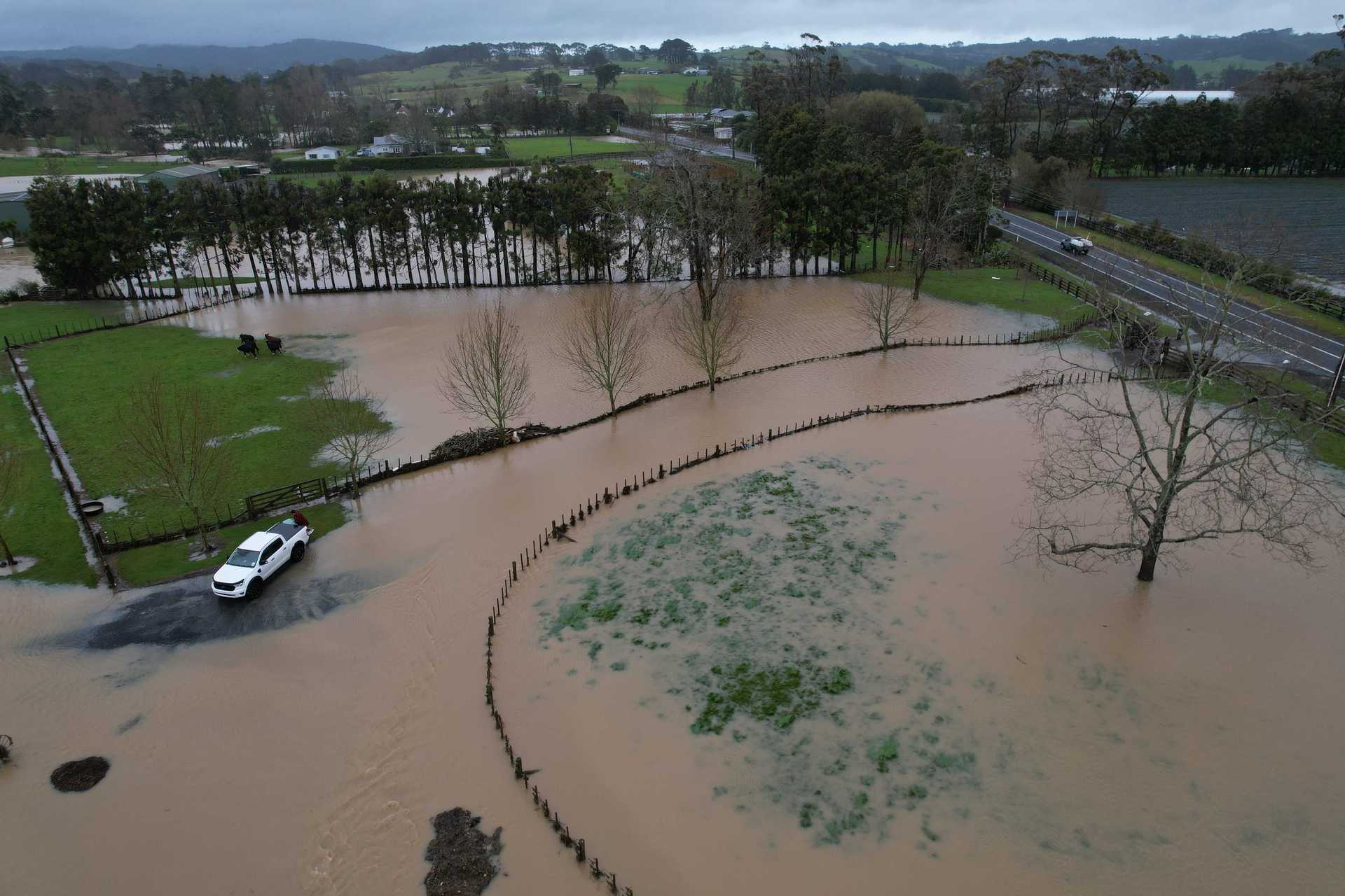 Flooding along Waitakere Road at Taupaki. Photo / Brett Phibbs