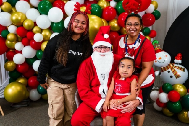 Nina Grace with her family and Santa at last year's Christmas party.