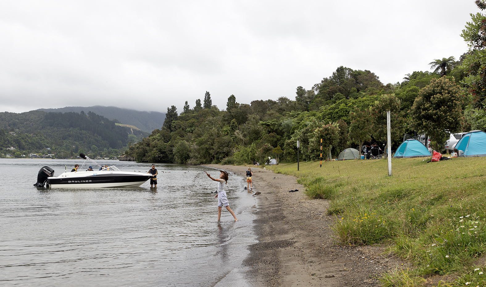 Summer camping and boating at Lake Okareka DoC campsite. Photo / Andrew Warner