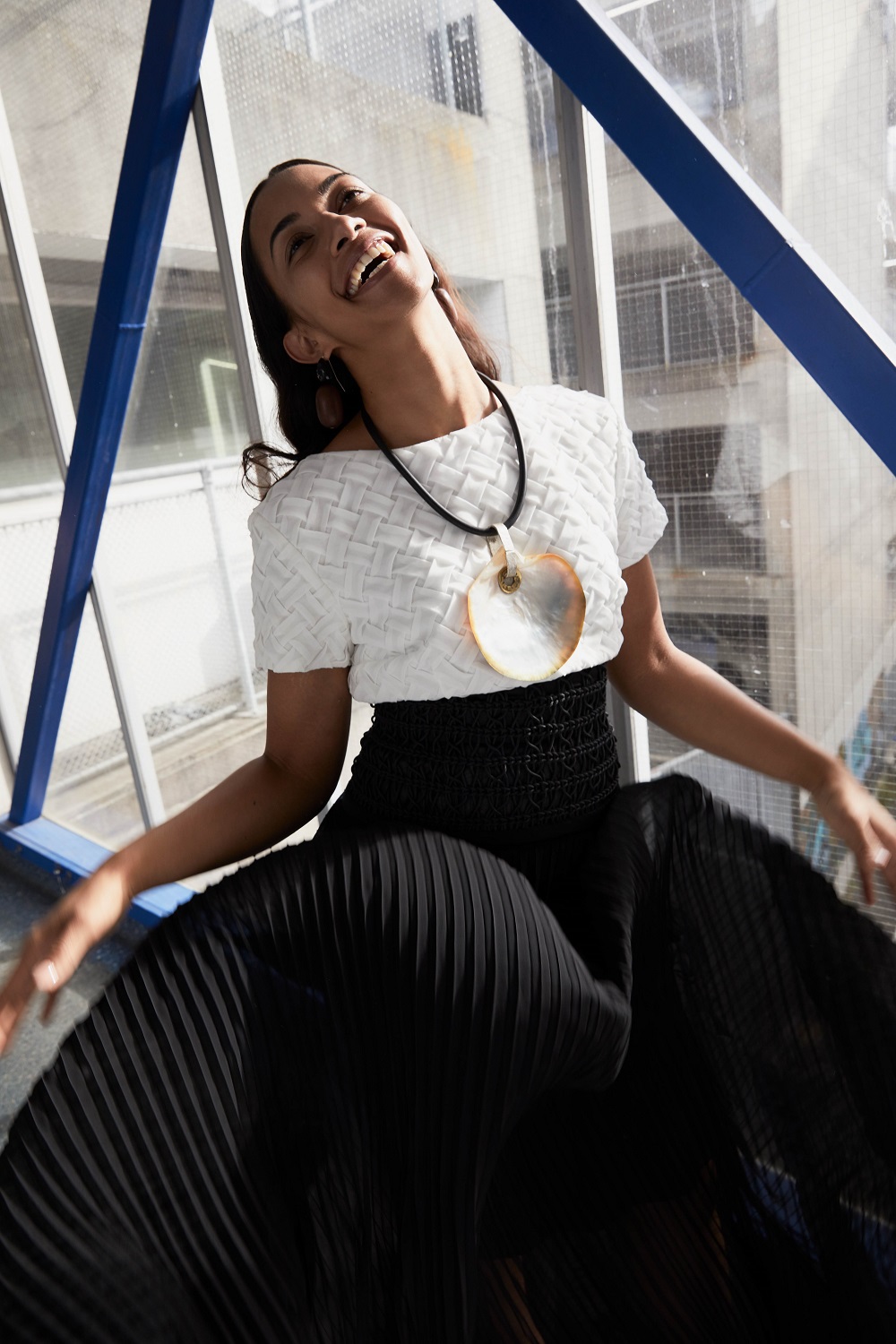 TE AO MAORI: Layla wears Kiri Nathan top, skirt and hand woven belt (2018). Neil Adcock mother of pearl pendant. Photo/ Mara Sommer