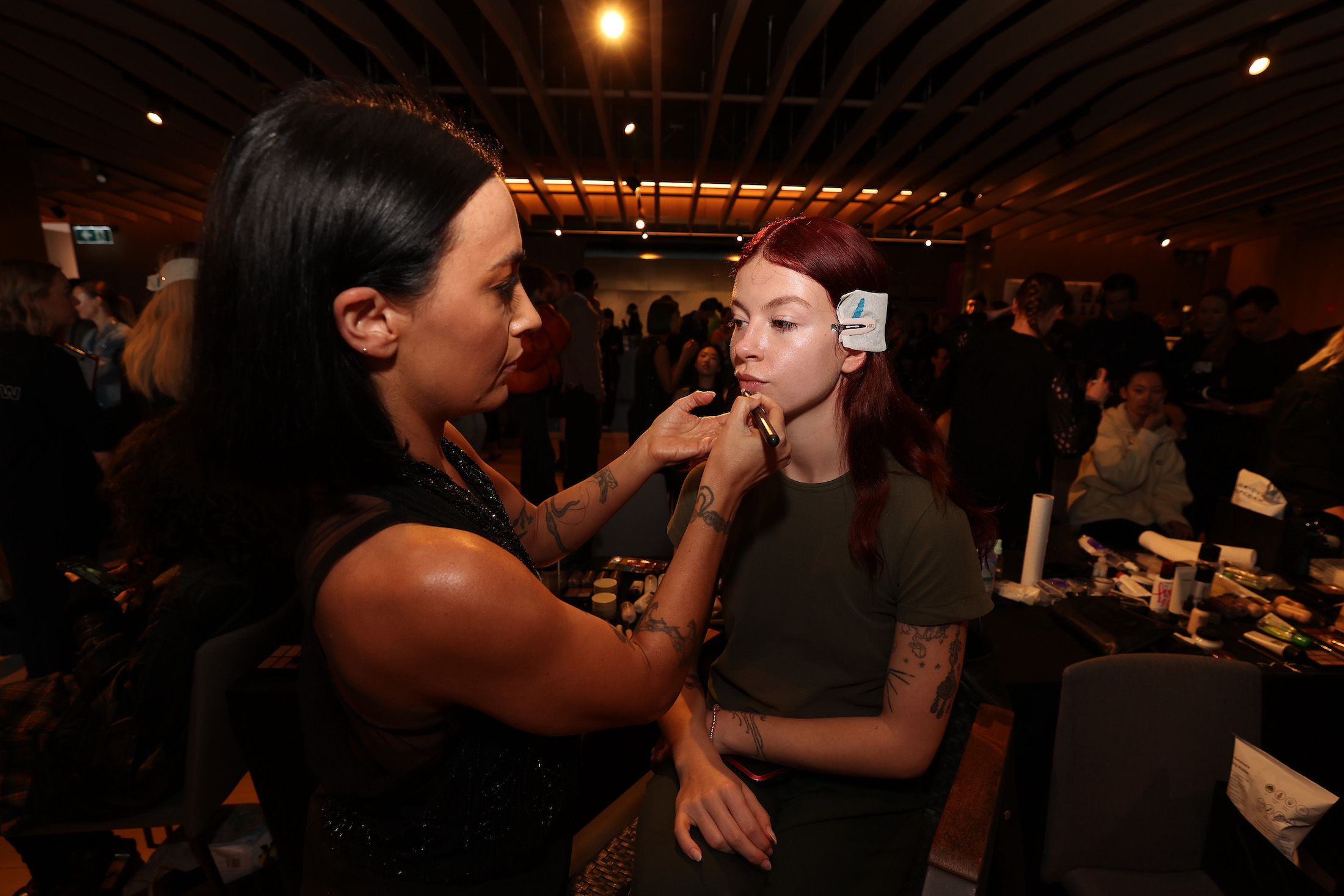 A model prepares backstage ahead of the Zambesi show during New Zealand Fashion Week 23: Kahuria. Photo / Getty Images