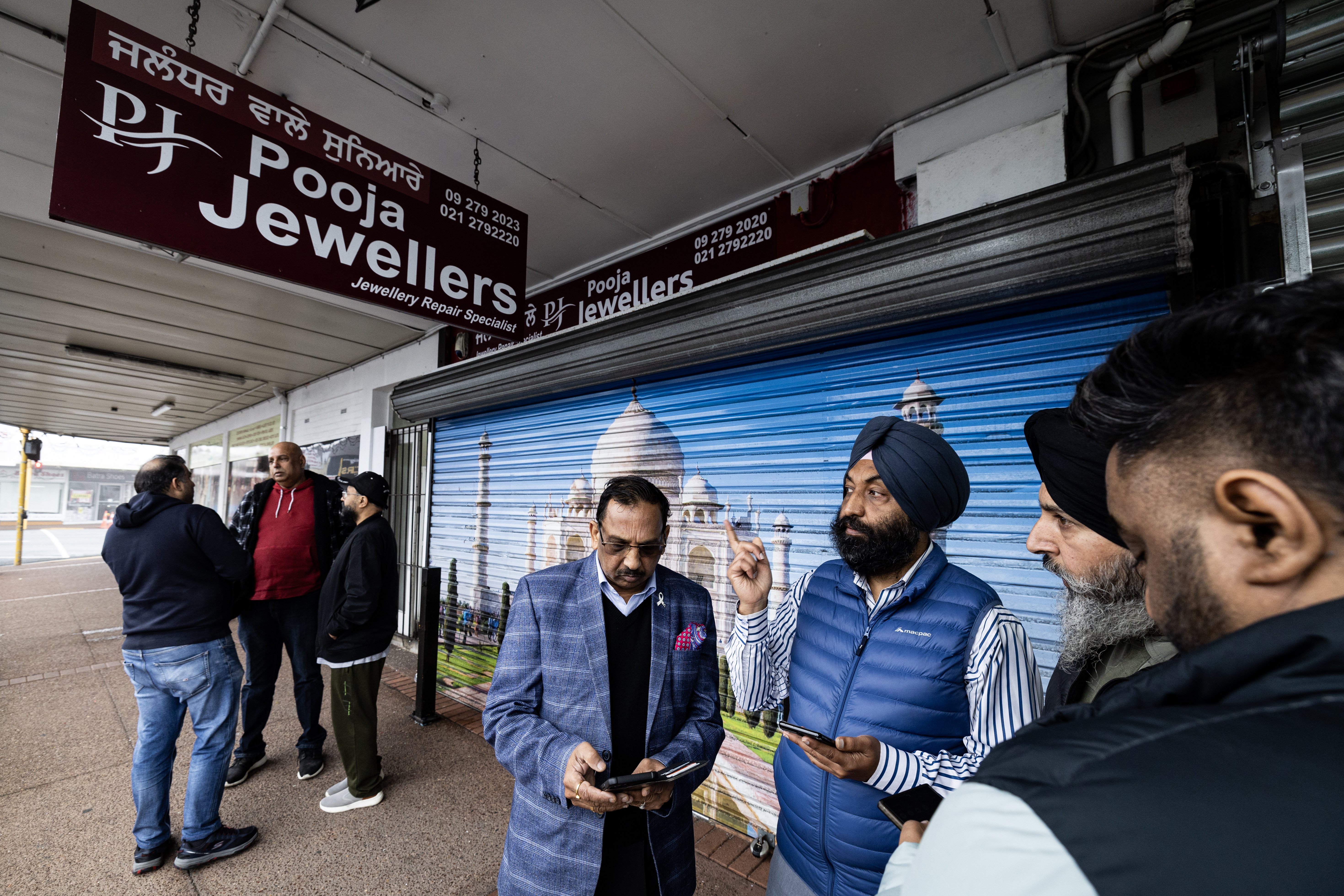 Local business and community leaders gather outside Pooja Jewellers in Papatoetoe after a violent aggravated robbery at the store. Photo / Jason Oxenham 