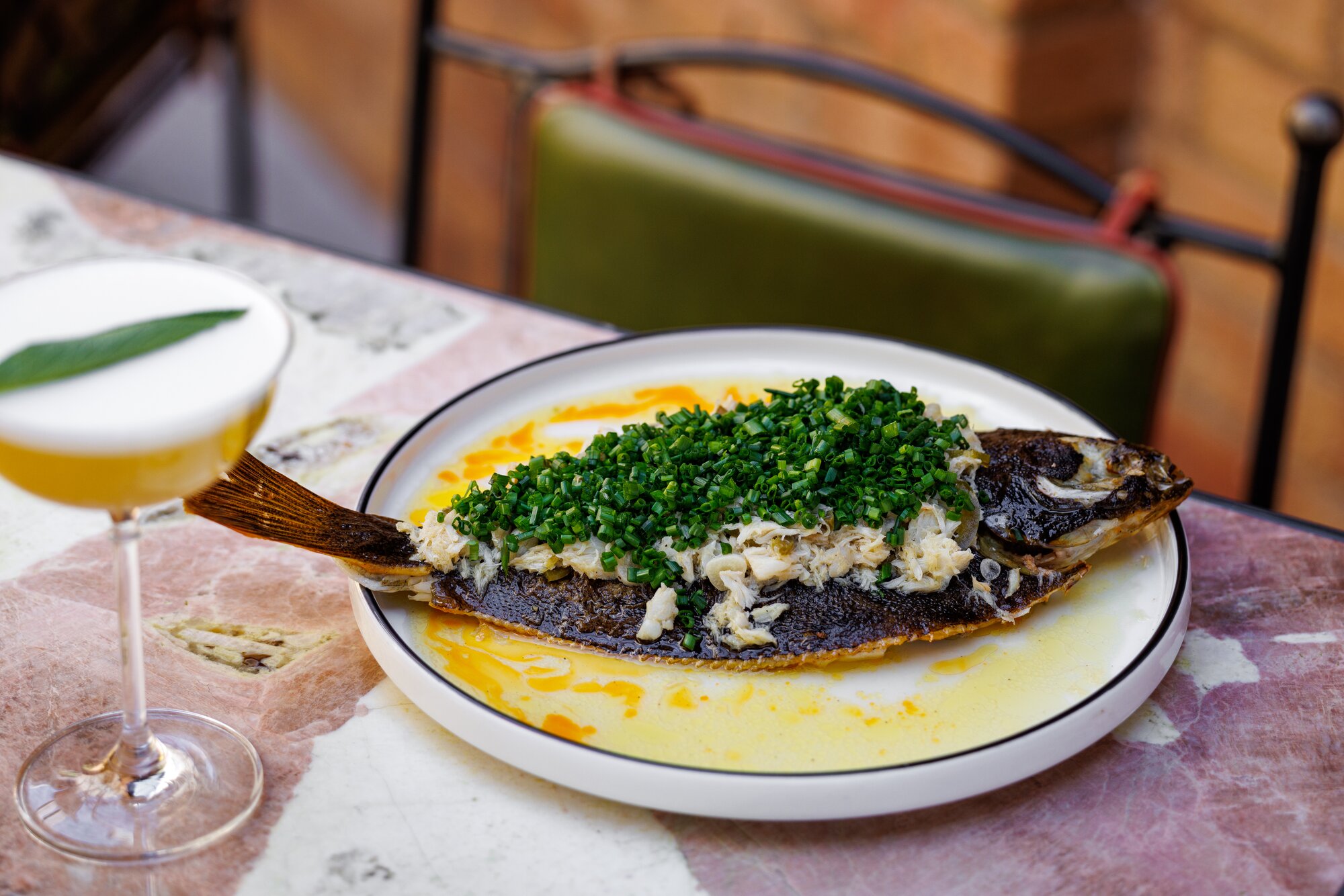 Jacuzzi's whole flounder comes piled high with indulgent crab. Photo / Babiche Martens. 