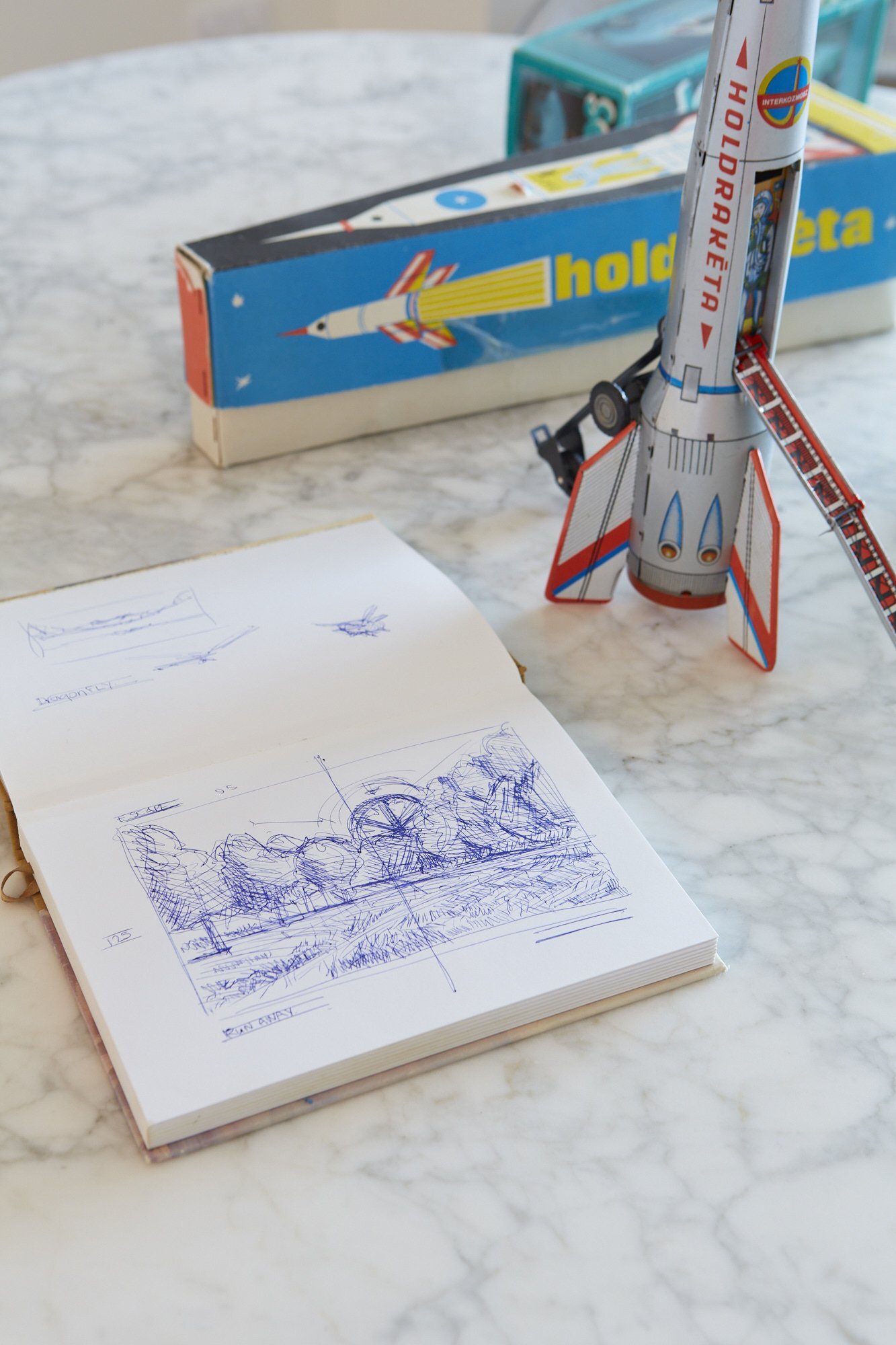 Sketchbook and rocket by Ross Jones, part of the Fine Artist - Ross Jones exhibition at Parnell Gallery.