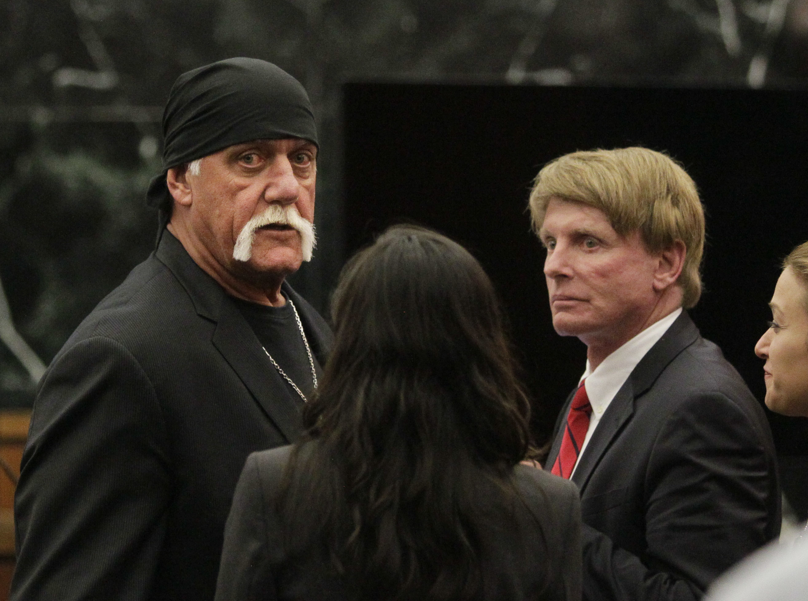 Hulk Hogan, whose given name is Terry Bollea, left, looks on in court moments after a jury returned its decision in Floride. Photo / AP