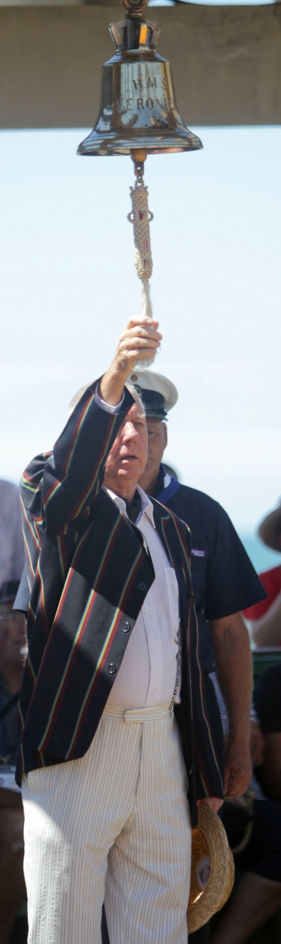 Roger Jackman, whose father served aboard HMS Veronica, stepped forward to ring the ship's bell at yesterday's service. Photo / Paul Taylor
