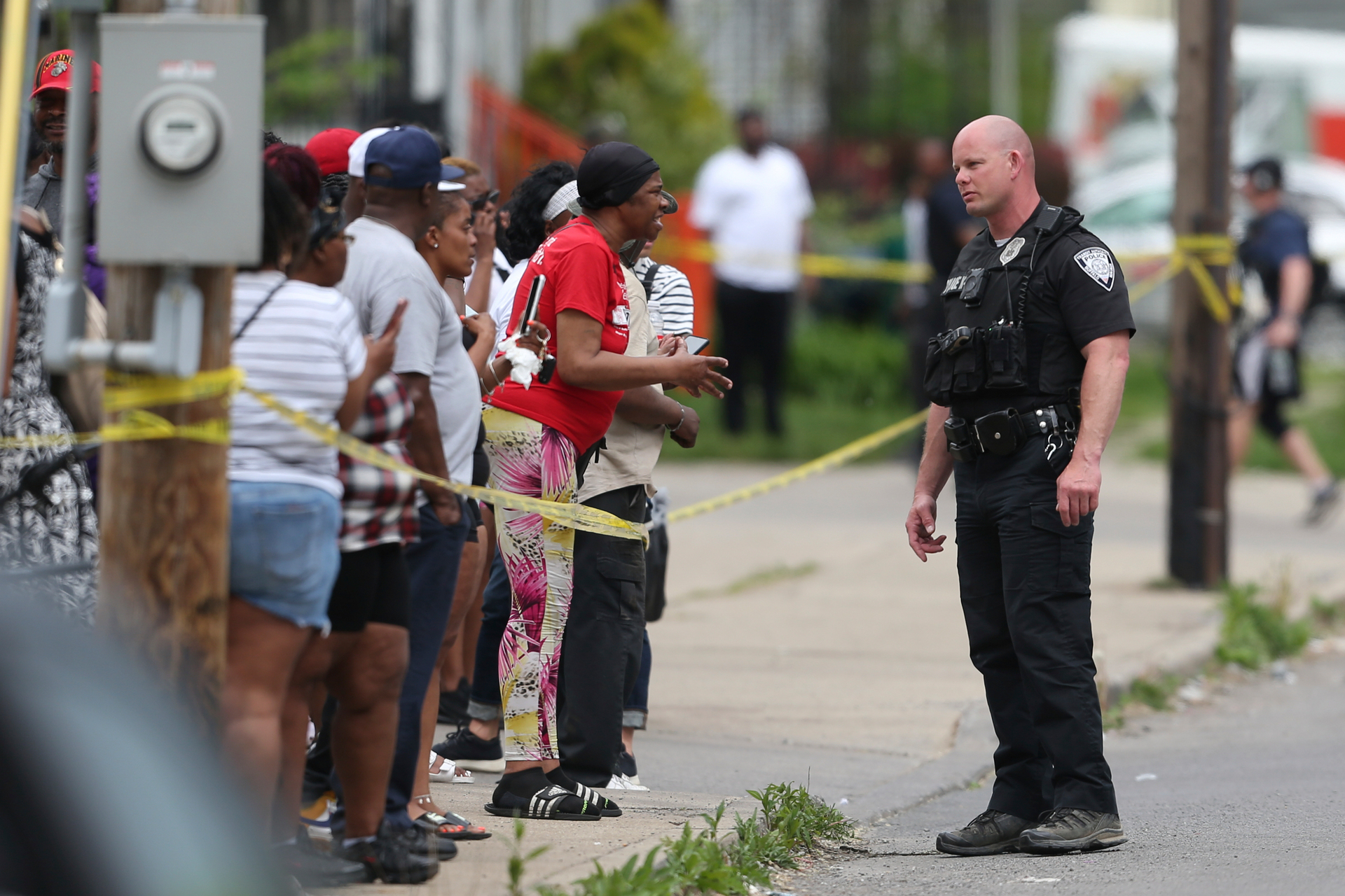 Police speak to bystanders while investigating after a shooting at a supermarket in Buffalo, New York. Photo / AP