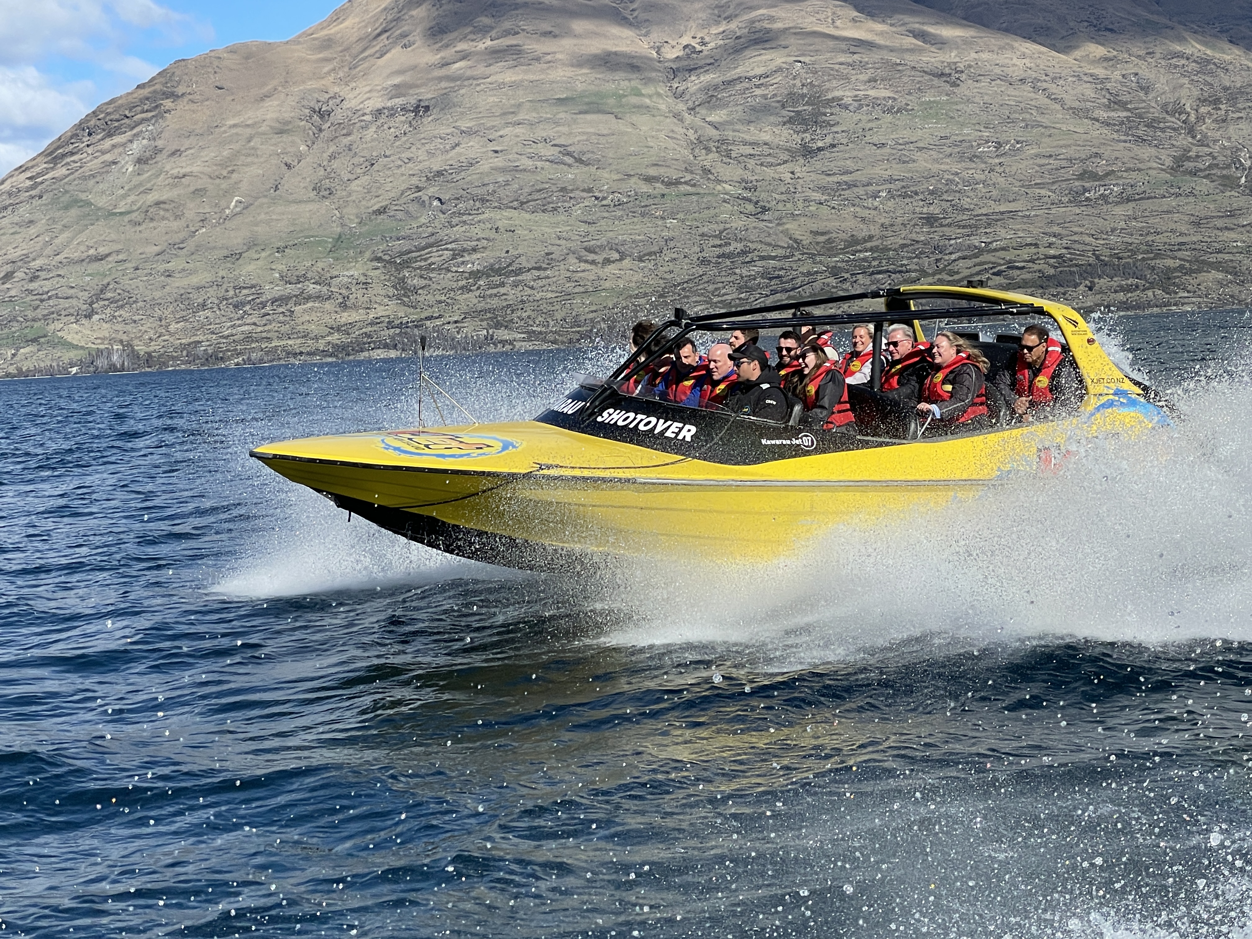 National leader Christopher Luxon takes a spin on Lake Wakatipu at the front of the Kjet. Photo / Derek Cheng
