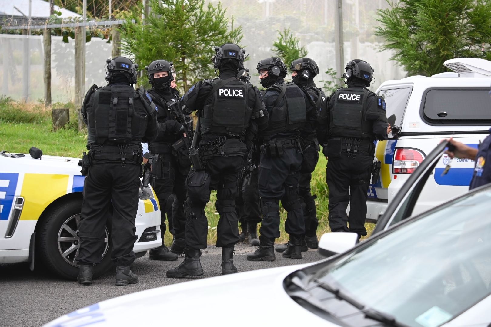 The Armed Offenders Squad at the scene of a shooting in what is believed to a Tauranga gang war. Photo / Sandra Conchie