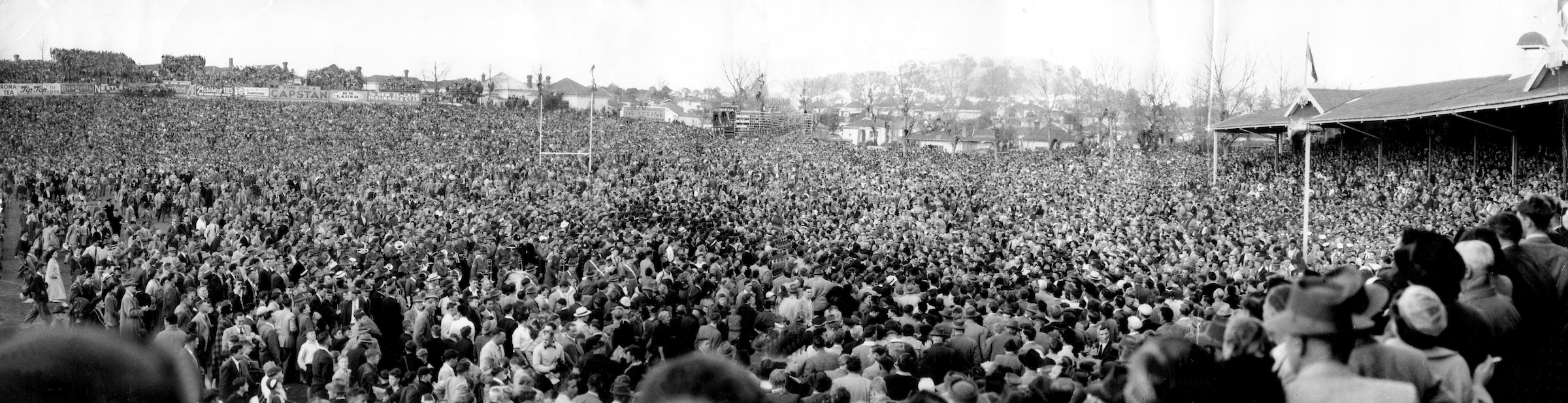 Kiwi fans celebrate on the field after victory in the 1956 series against the Springboks. Photo / Photosport