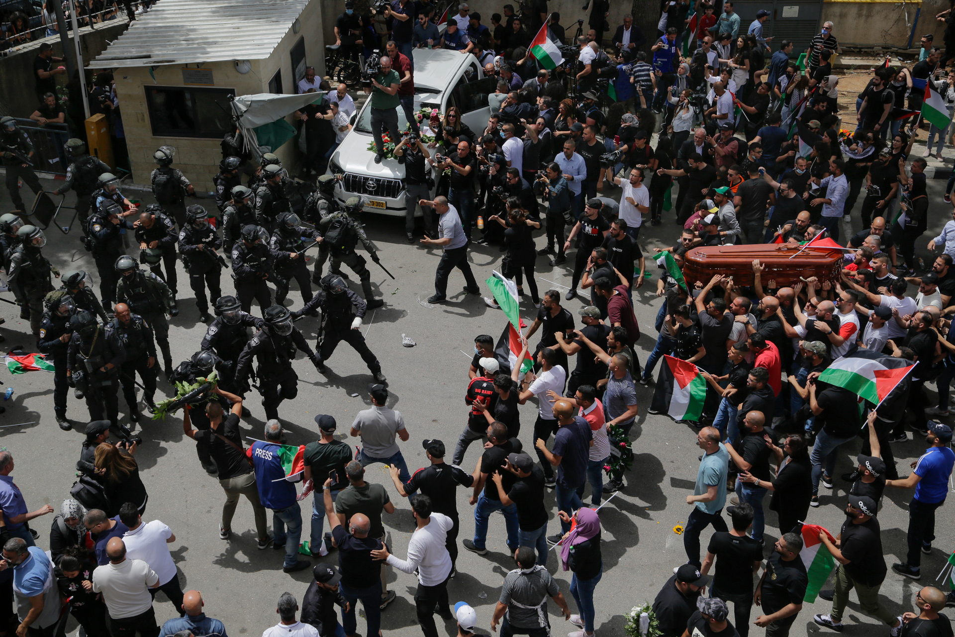 Israeli police confront with mourners as they carry the casket of slain Al Jazeera veteran journalist Shireen Abu Akleh during her funeral in east Jerusalem. Photo / AP