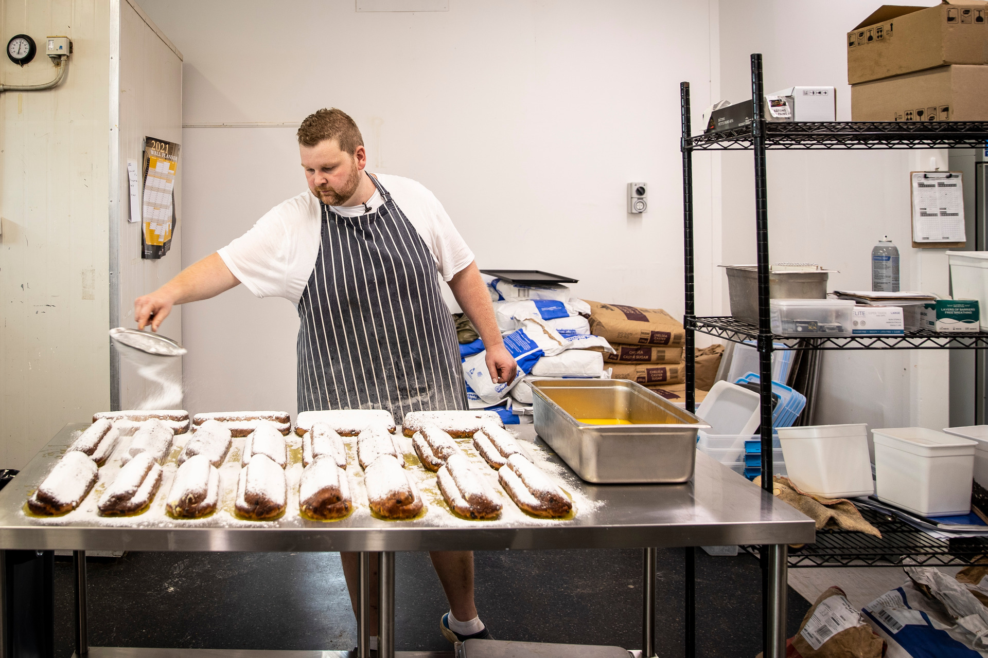 Patrick Welzenbach, applying the two-stage sugary crust that helps stollen keep for longer. Photo/Michael Craig