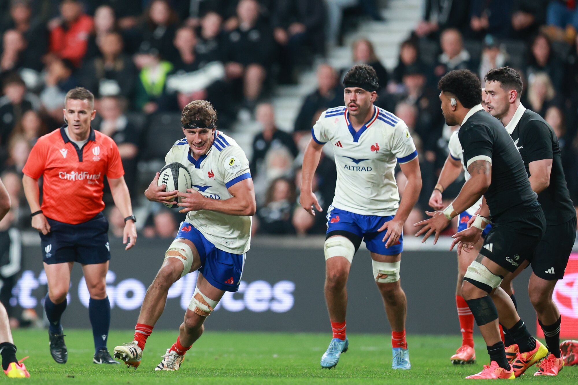 French player Oscar Jegou charges forward against the All Blacks, with the Nations Championship patch featuring on his left shoulder. Photo / Photosport