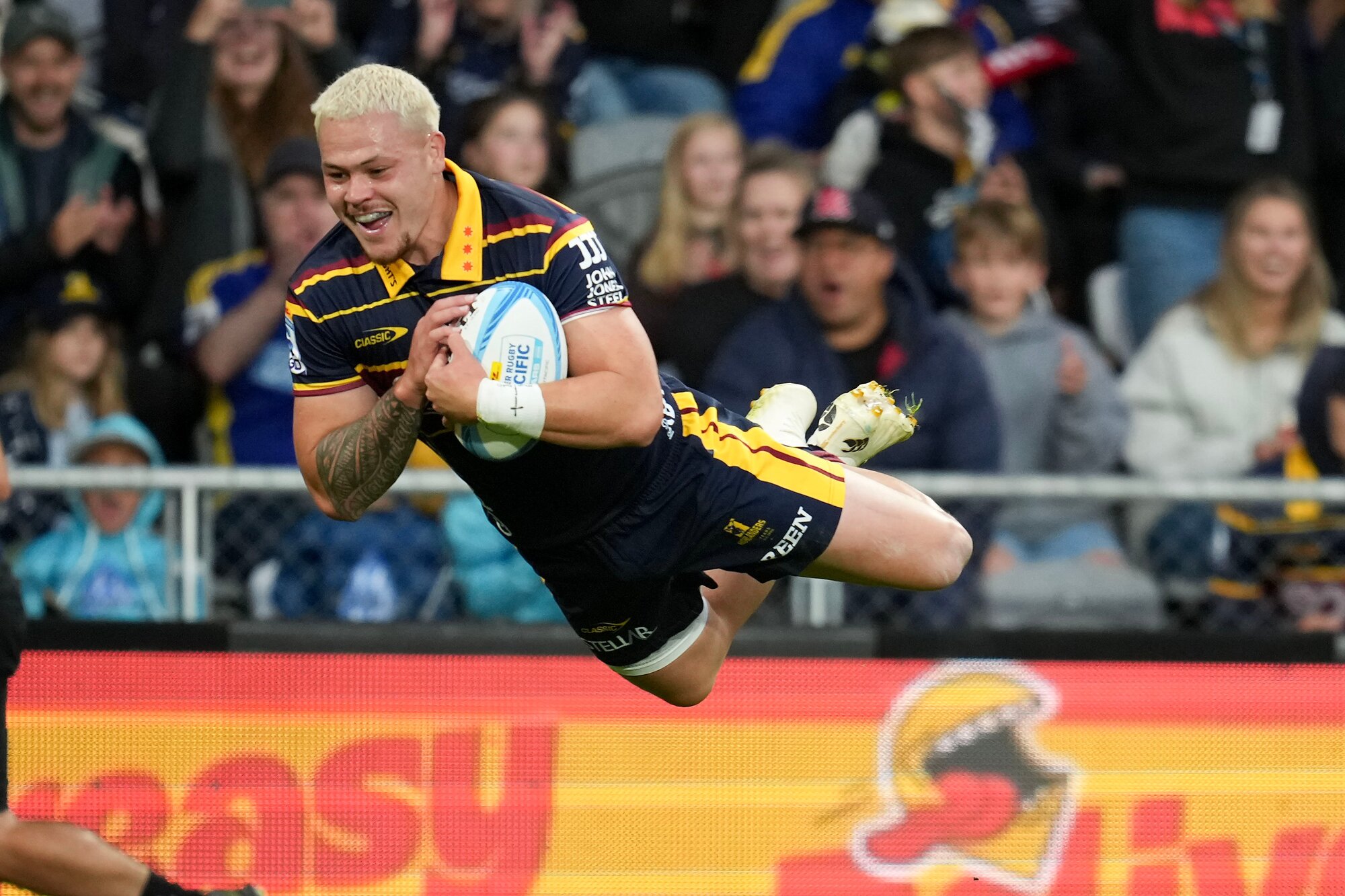 Highlanders Caleb Tangitau scores against the Crusaders in the Super Rugby opener, in Dunedin. Photo / Photosport
