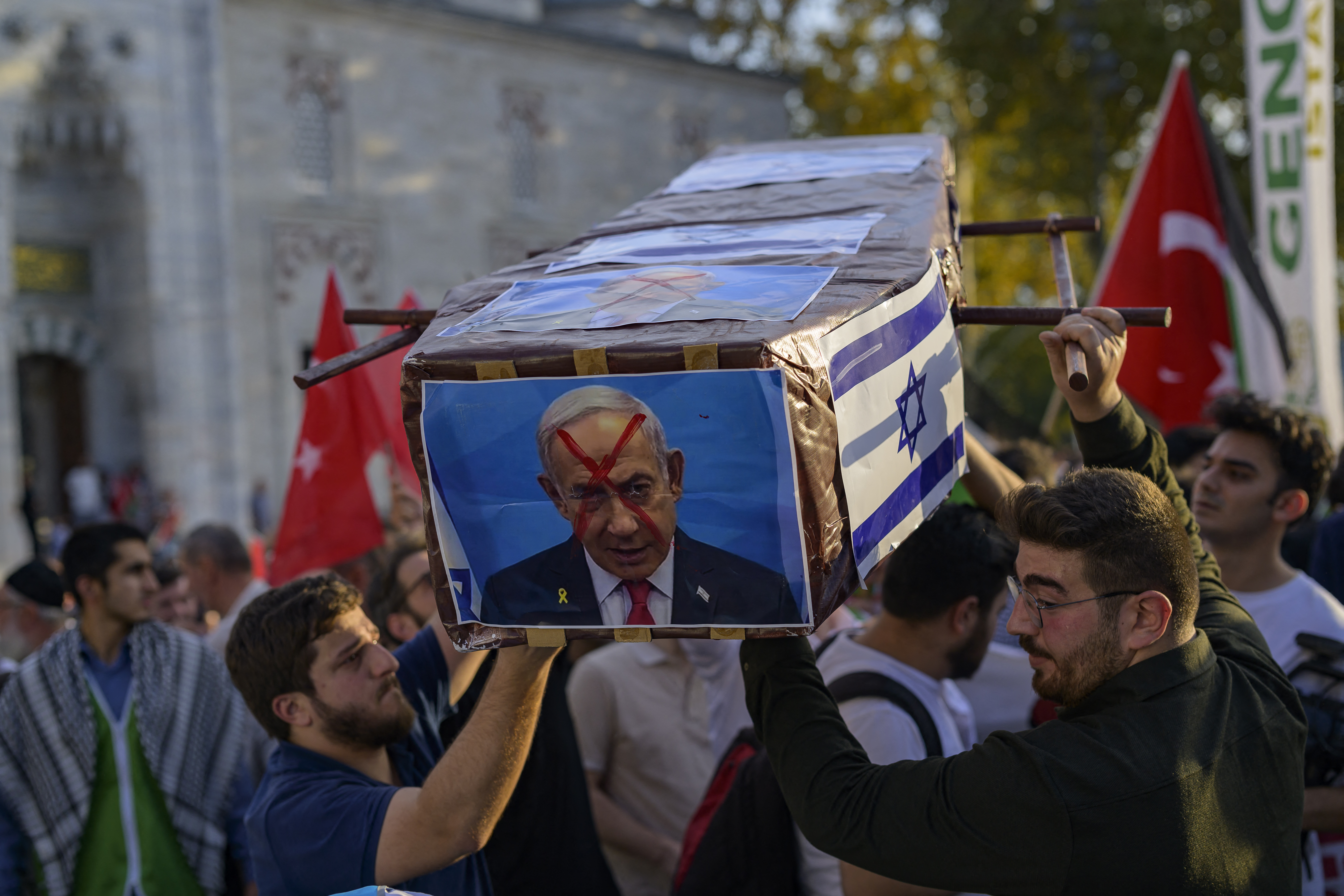 Protesters carry a mock coffin with a picture of Israel's Prime Minister Benjamin Netanyahu during a rally at the Beyazit Square in Istanbul, on October 6, 2024. Photo / AFP