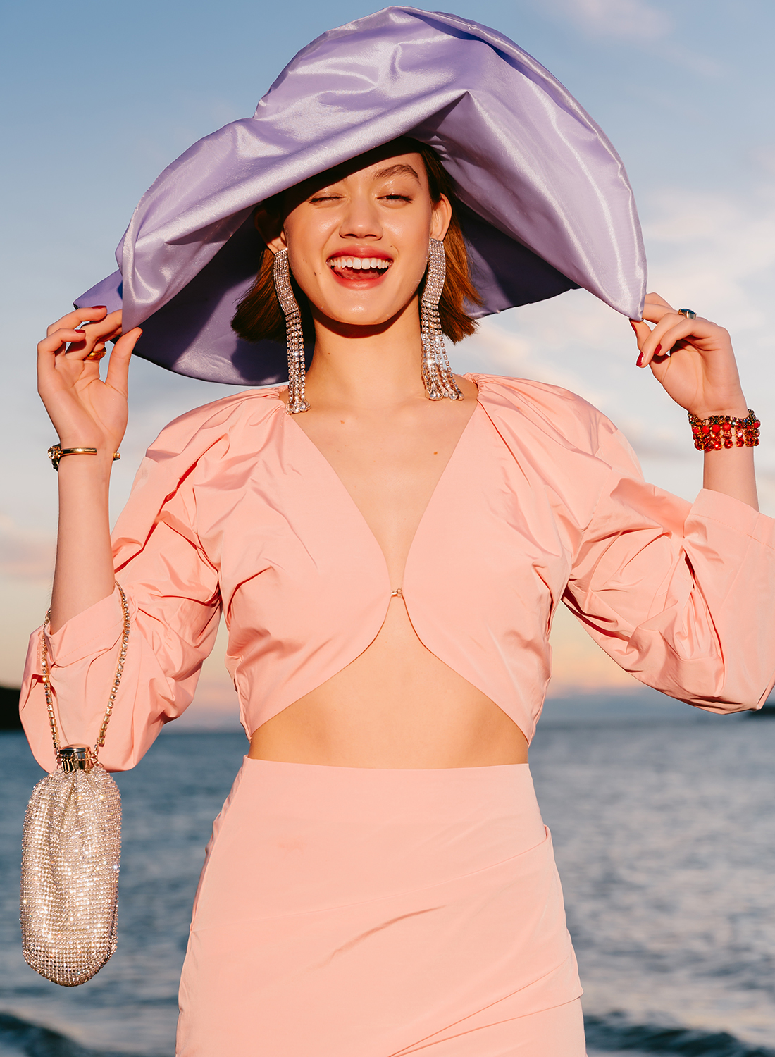Paris Georgia top, $640 and skirt, $580. Alessandra Rich earrings, $499, from Vestiaire Collective. Rotate bag, $195, from Depop. Coloured crystal bracelets, from $125, from Hunters & Collectors. Photo / Grace Gemuhluoglu