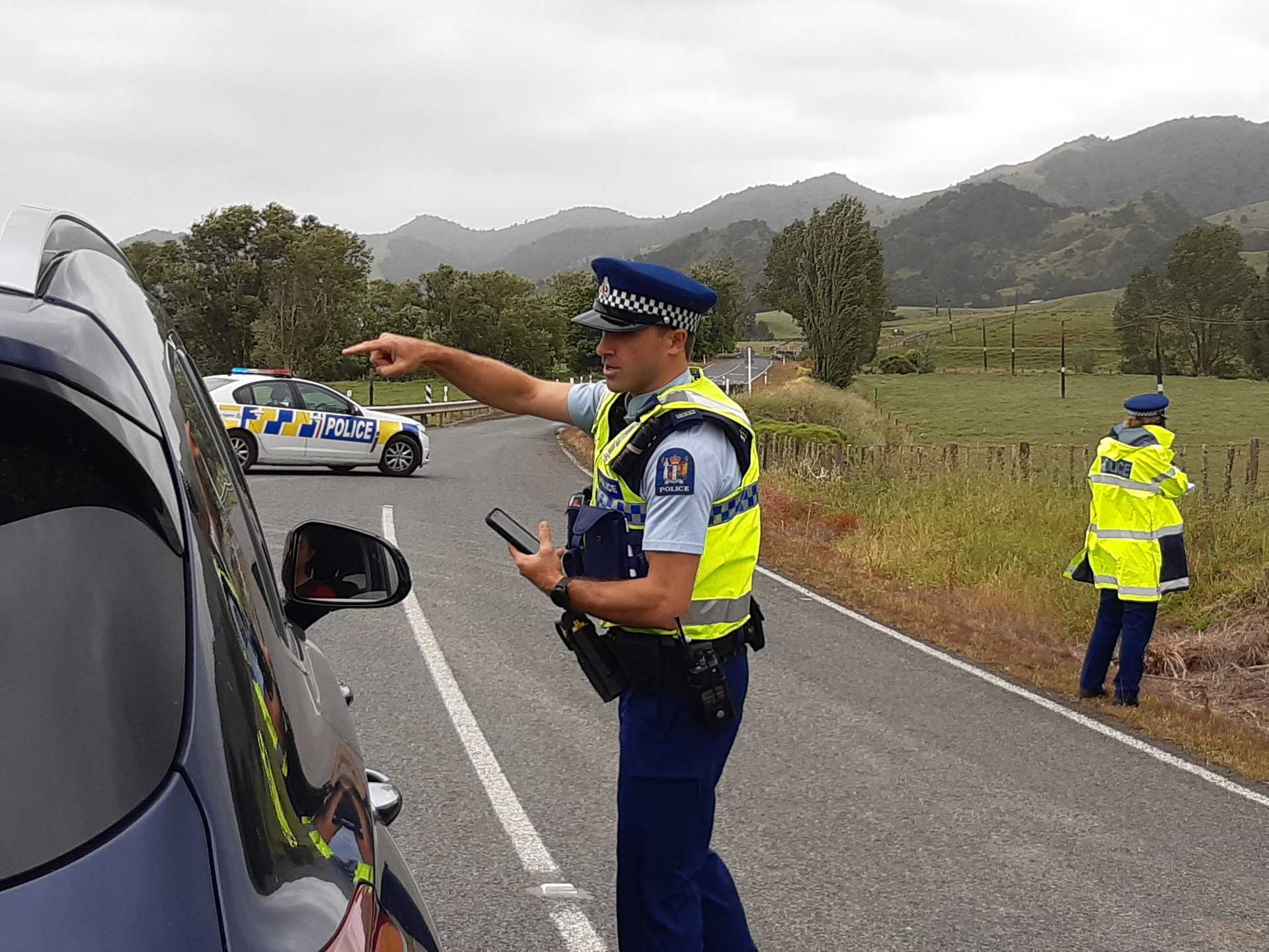 Police cordon at the scene of the shooting on Tangowahine Valley Rd off State Highway 14. Photo / Tania Whyte