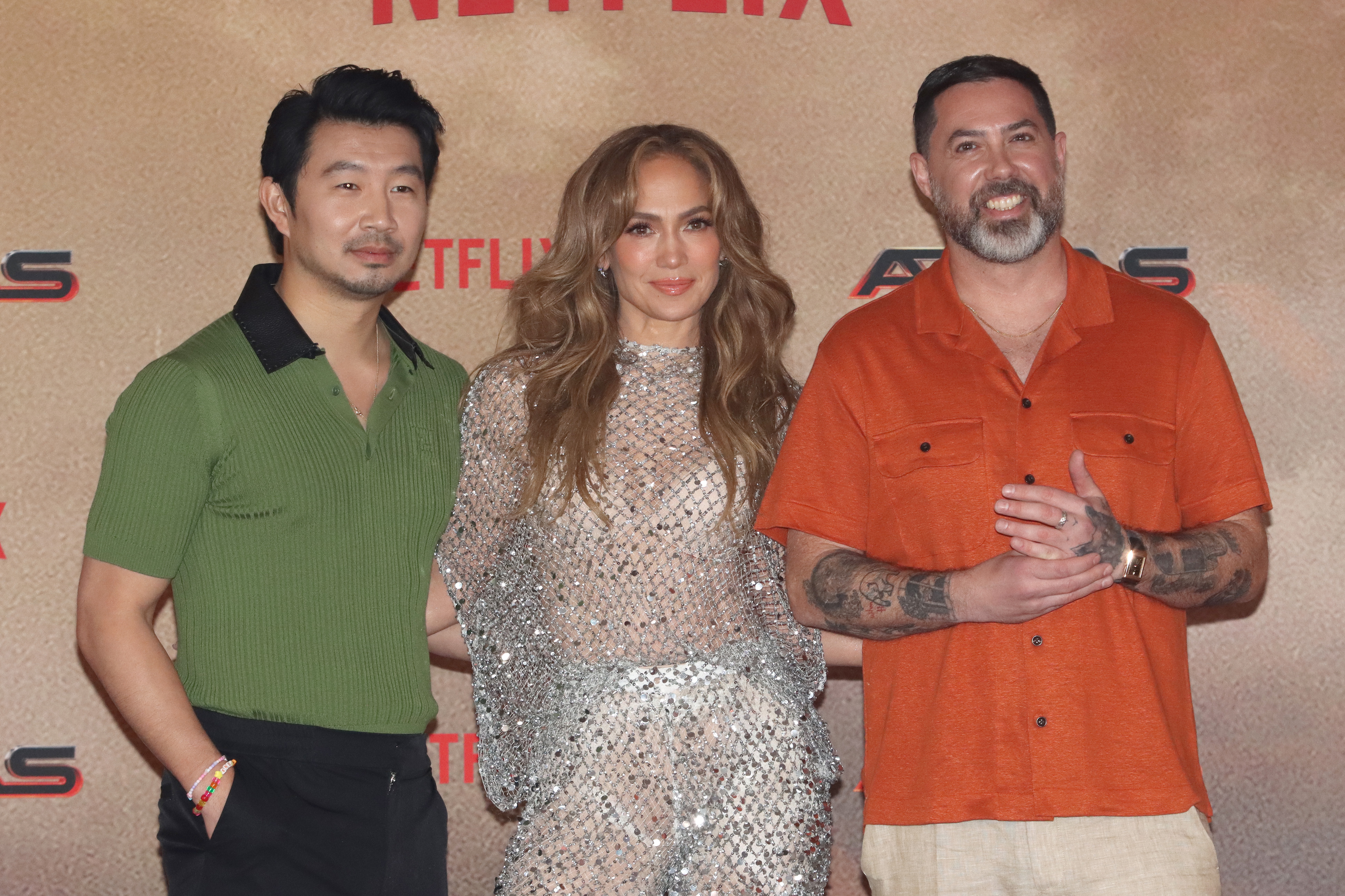 Simu Liu (left), Jennifer Lopez and Brad Peyton pose after a press conference about their new film, Atlas. Photo / Getty Images