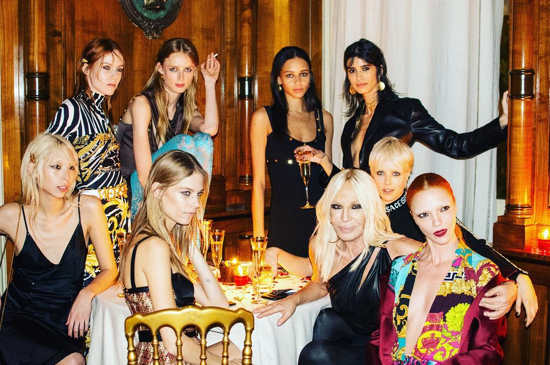 Donatella Versace sits with models after the Versace fall/winter 19 show in Milan. Photo / Instagram @donatella_versace 