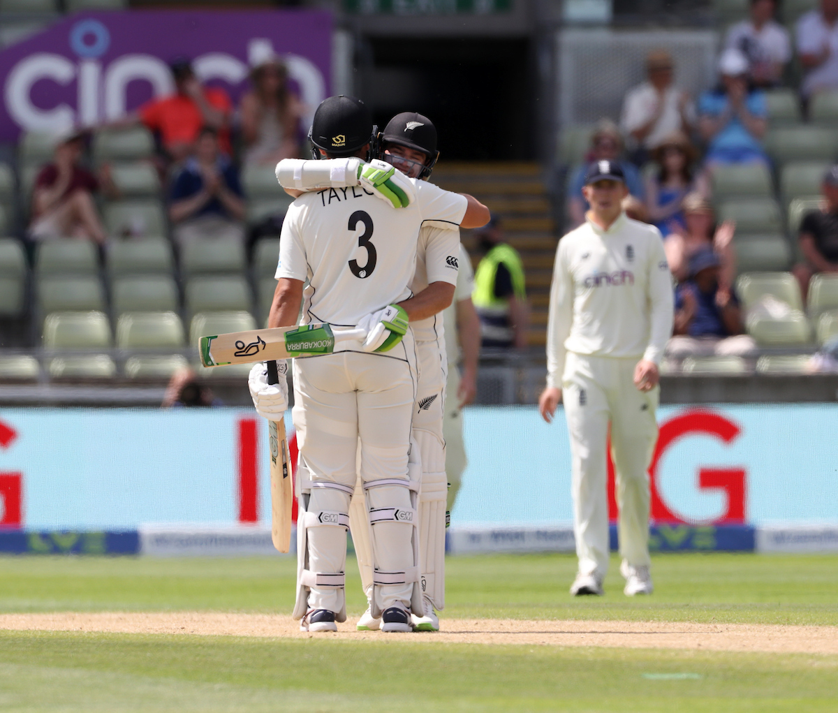 Tom Latham embraces Ross Taylor after hitting the winning runs. Photo / Photosport