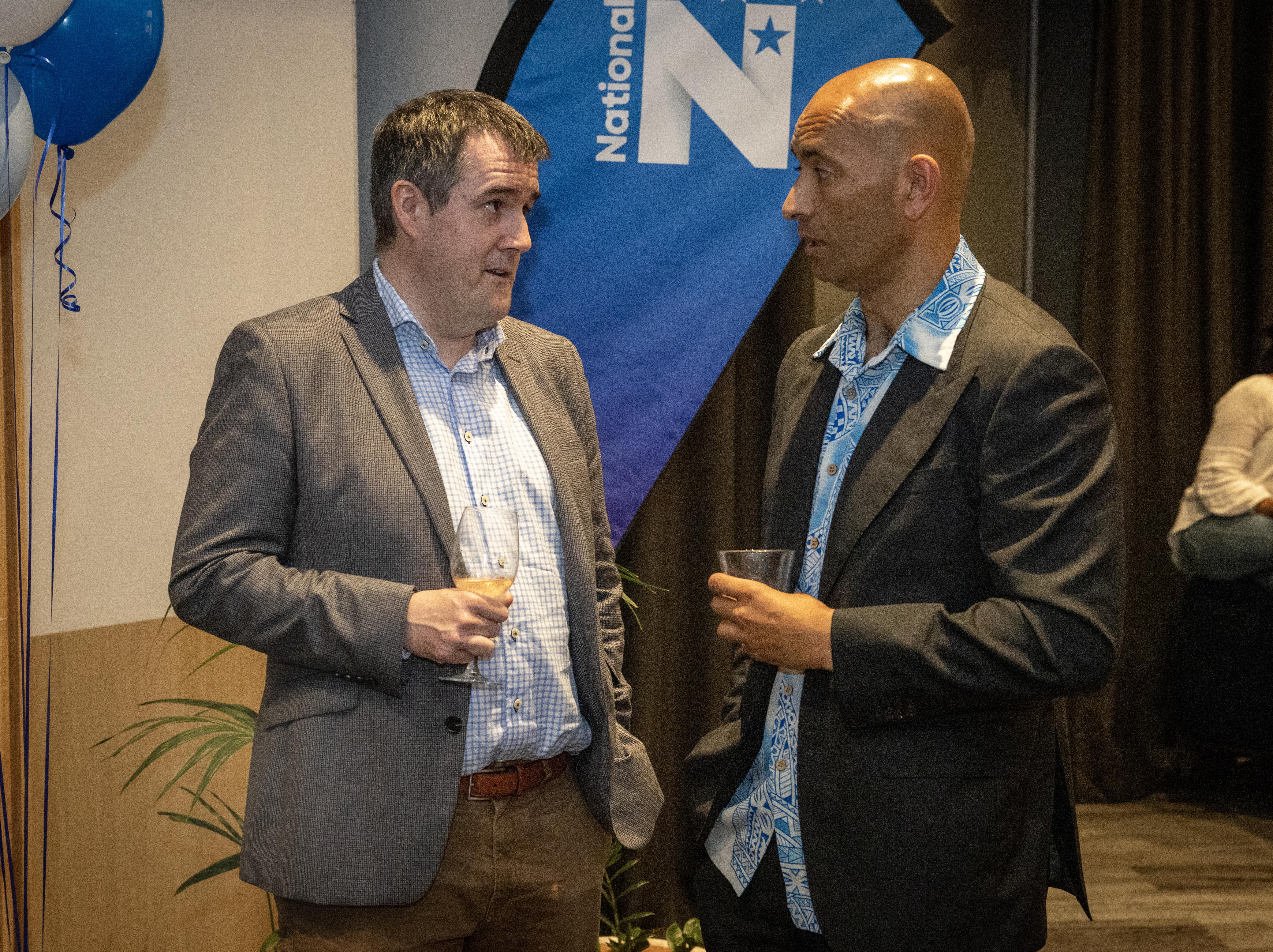 National MP Chris Bishop talks to candidate Tama Potaka as they wait for votes to be counted. Photo / Mike Scott
