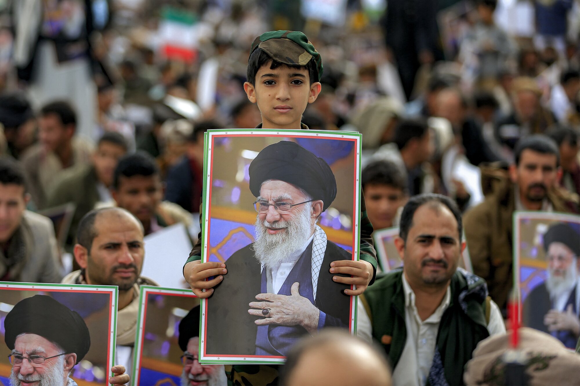 A boy holds a picture of Iran's supreme leader Ali Khamenei during a memorial rally held by supporters of Yemen's Huthis. Photo / Mohammed Huwais, AFP