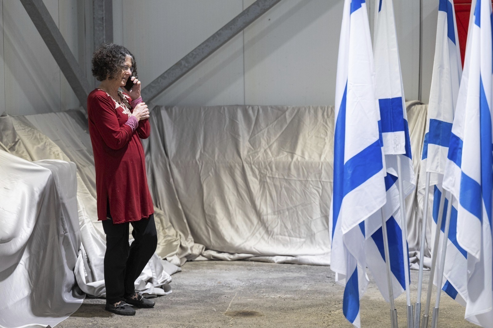 Shoshan Haran speaking on the phone upon her arrival in Israel after being freed. Shoshan was one of the 13 Israeli hostages that Hamas released. Photo / AP