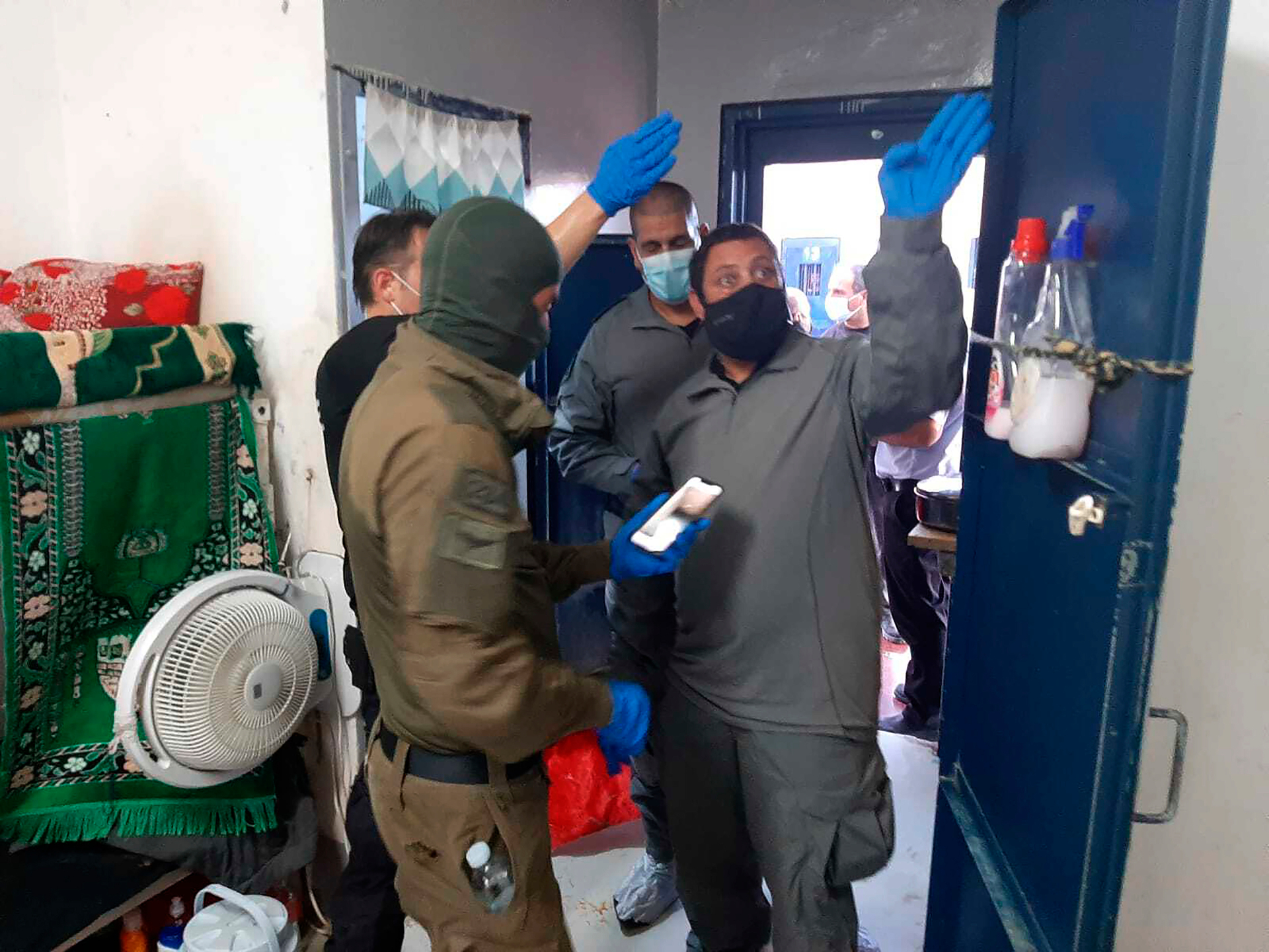 In this photo provided by Israel's Prisons Service, Israeli security personnel inspect a cell after six Palestinians escaped through a tunnel the Gilboa prison in north Israel. Photo / AP