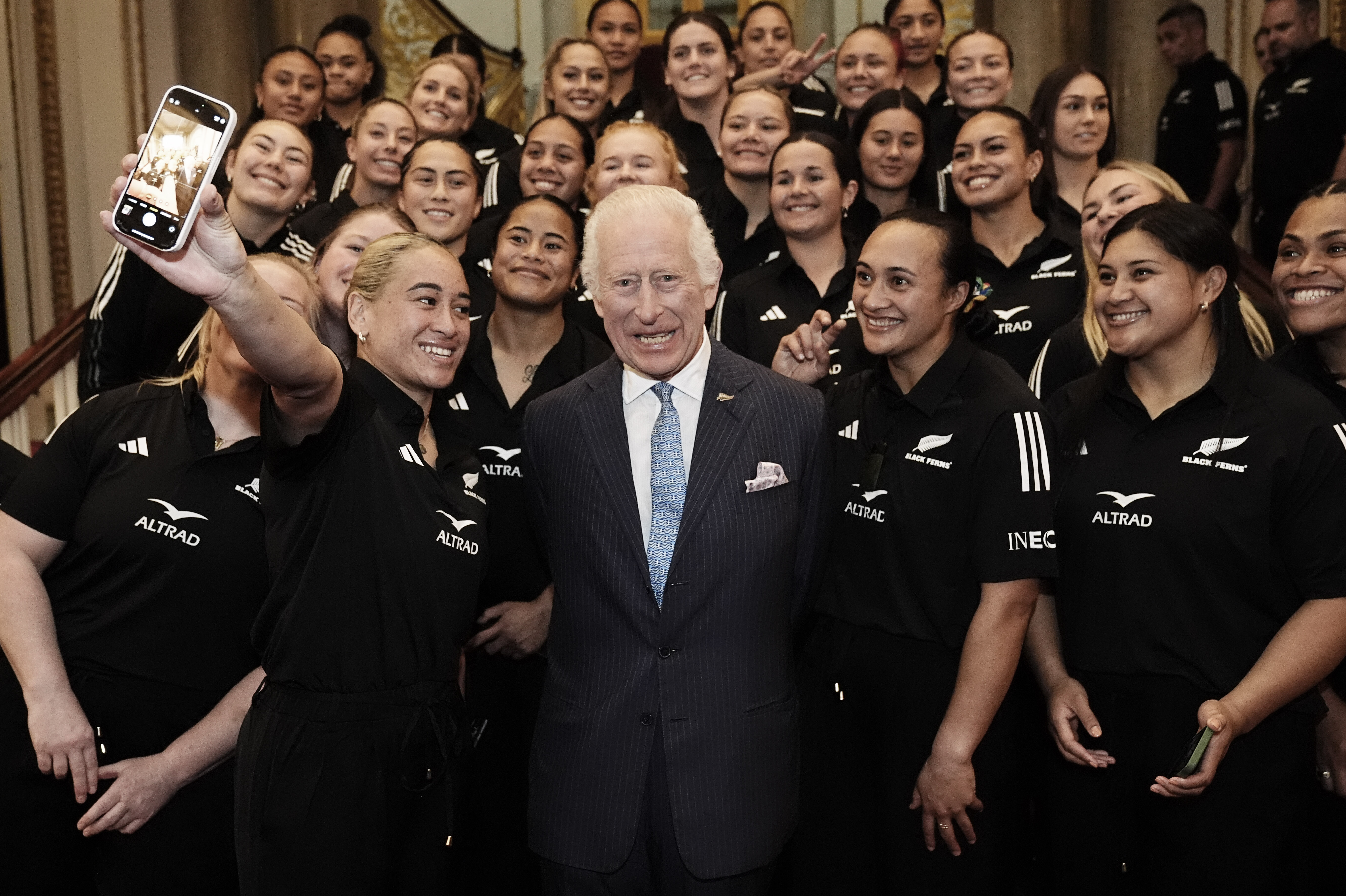 King Charles has his photograph taken with New Zealand's Black Ferns rugby union team on the Grand Staircase at Buckingham Palace on September 11 in London. Photo / Getty Images