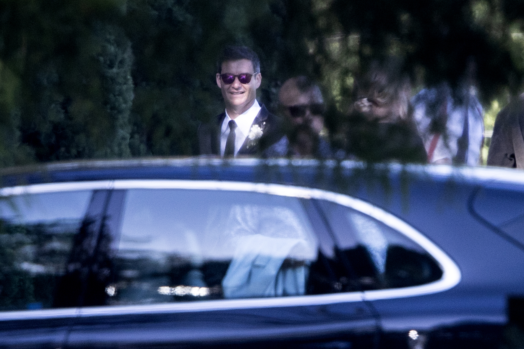 Clarke Gayford wore a black suit with a black tie and a white shirt. Photo / George Heard