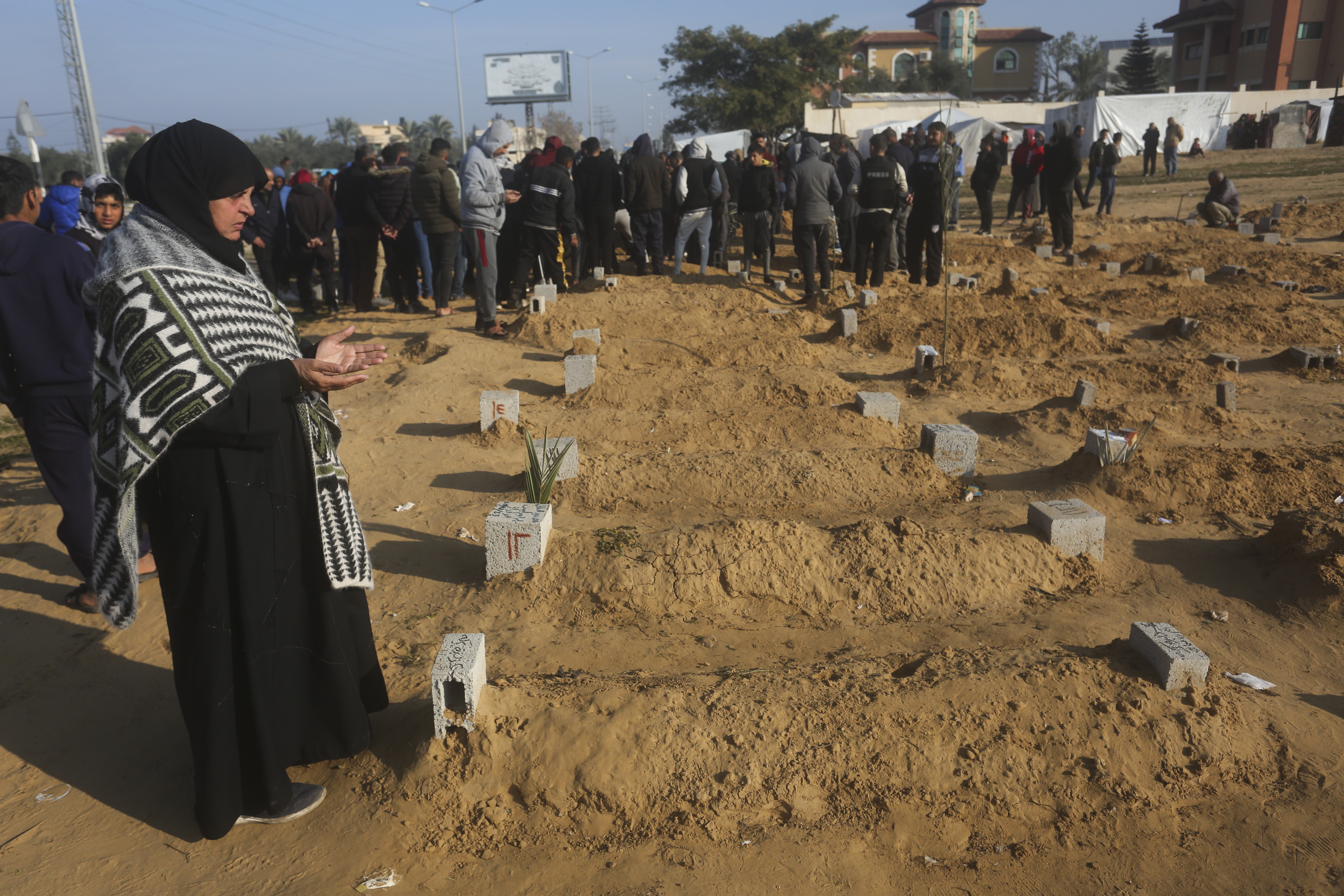A Palestinian woman prays for a relative killed in the Israeli bombardment of the Gaza Strip in Khan Younis. Photo / AP
